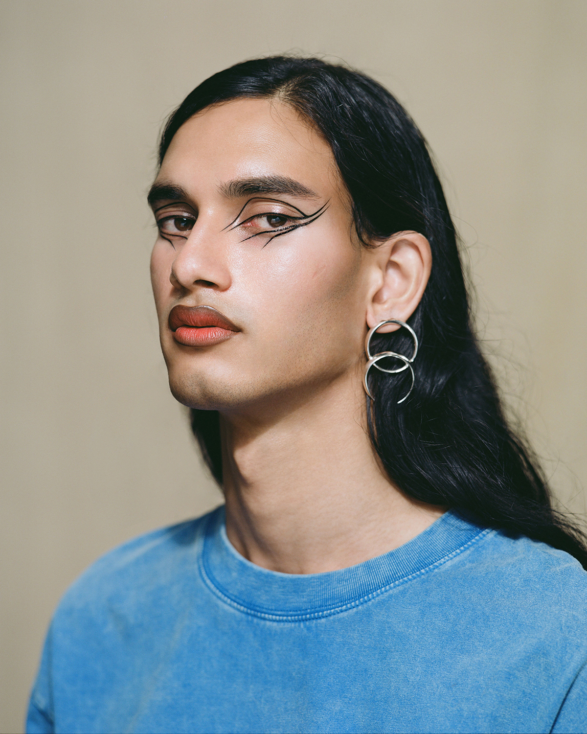 Shaneel wears Mitchell & Ness vintage T-shirt $95. Quim earrings $360. Photo / Hone Naera-Scott
