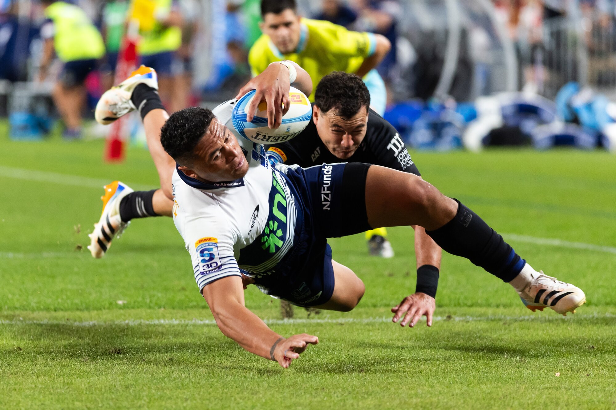 Blues winger Caleb Clarke scores against the Crusaders at Eden Park. Photo / Photosport