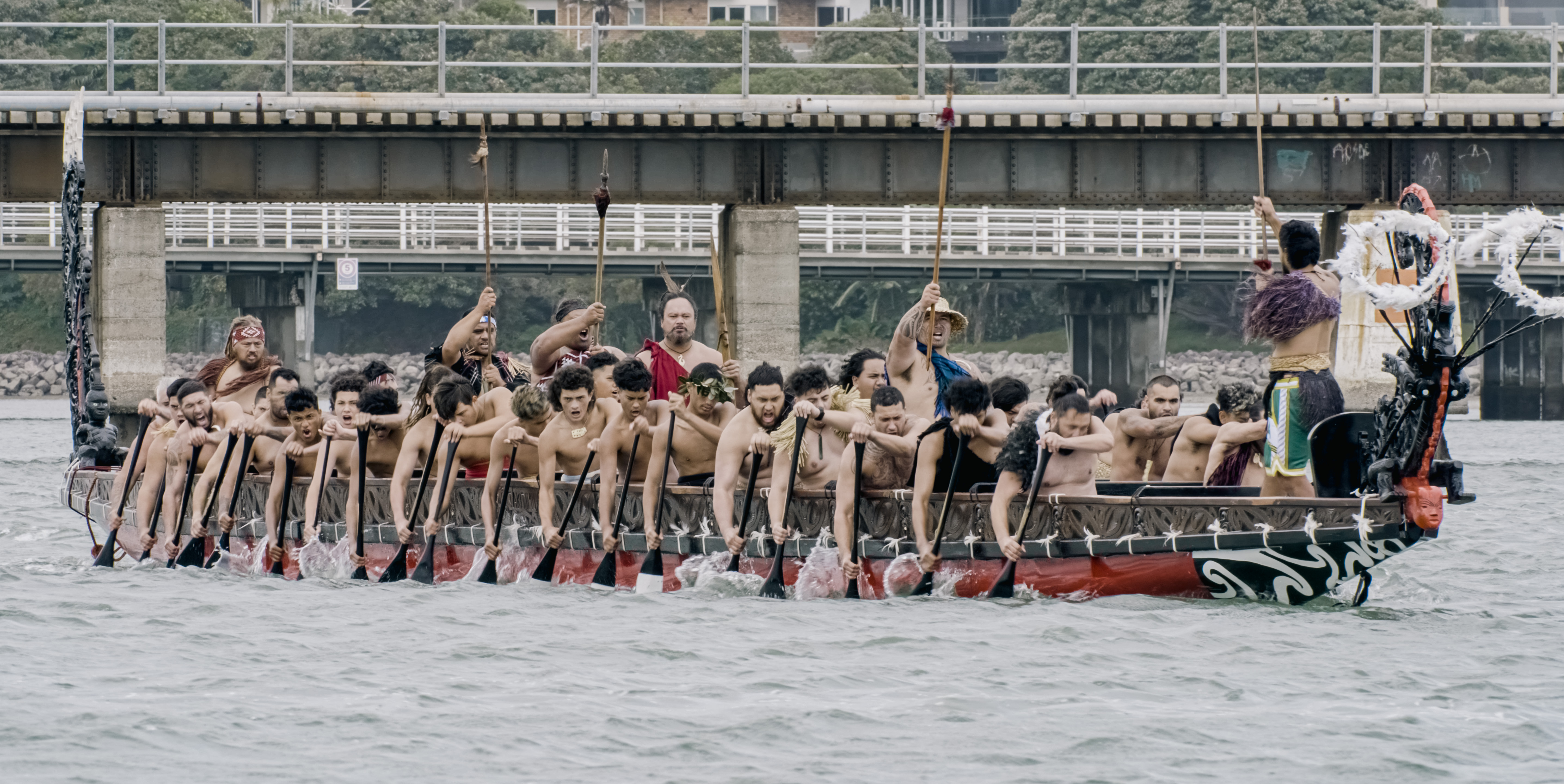 The Takitimu waka being paddled on the Tauranga harbour.