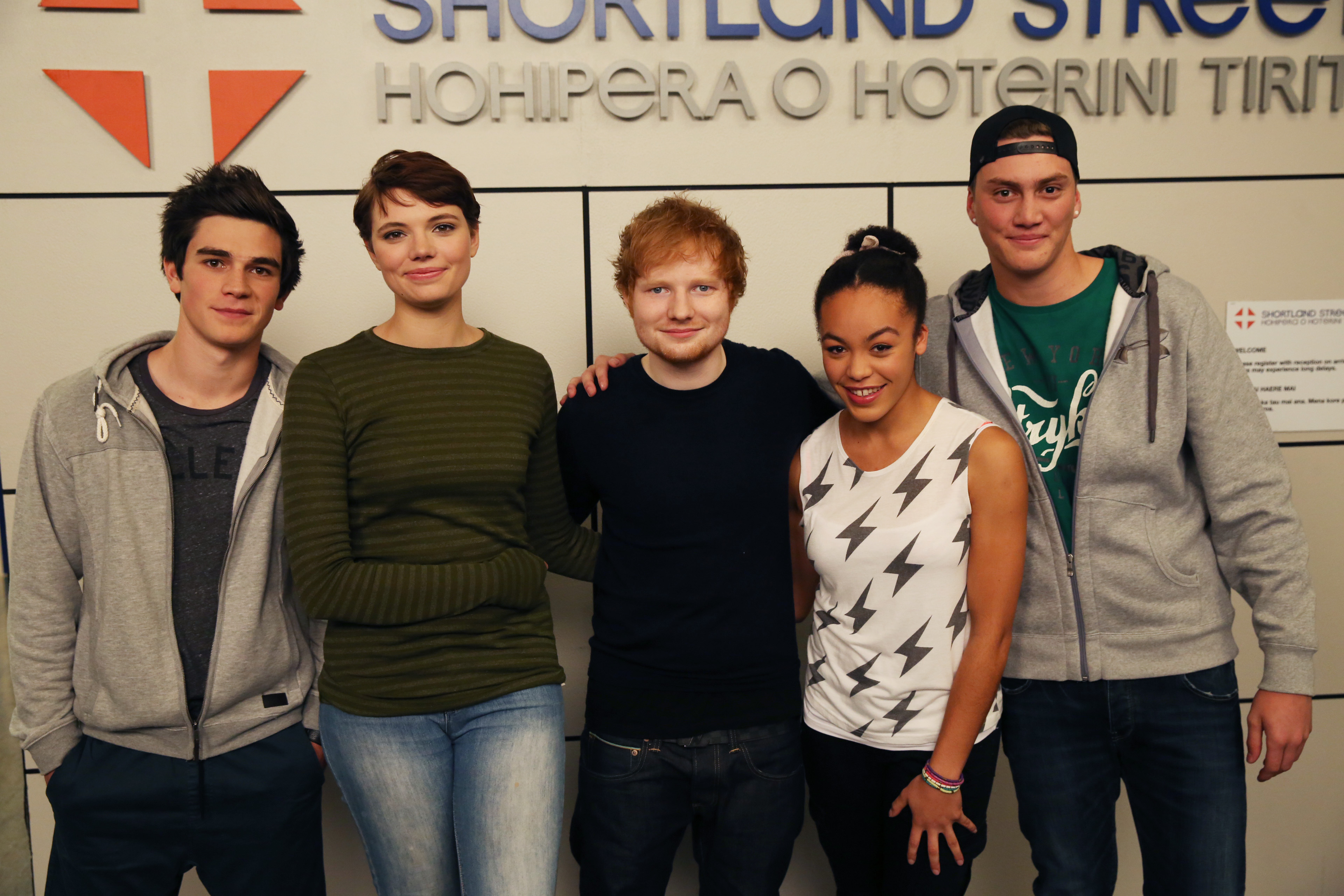 Ed Sheeran (centre) on the set of Shortland Street.