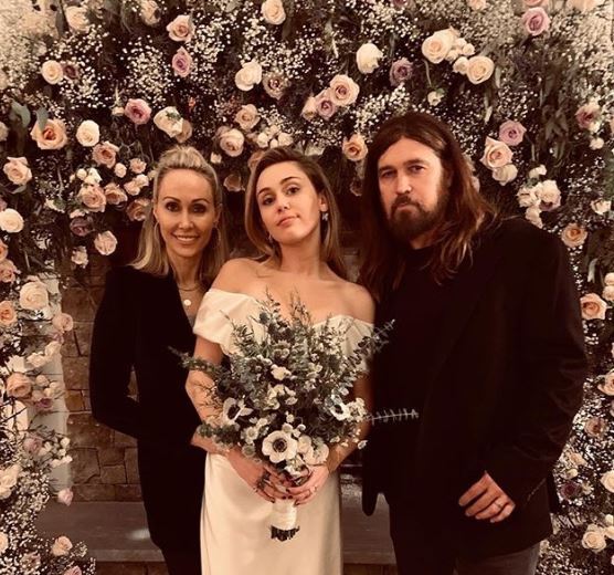Miley with her dad Billy Ray and her mother Tish. Photo / Instagram