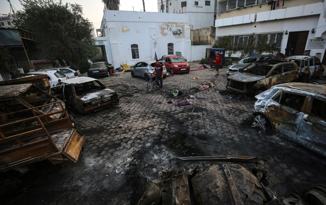Palestinian men look over the site of the deadly explosion at al-Ahli Hospital in Gaza City. Photo / AP
