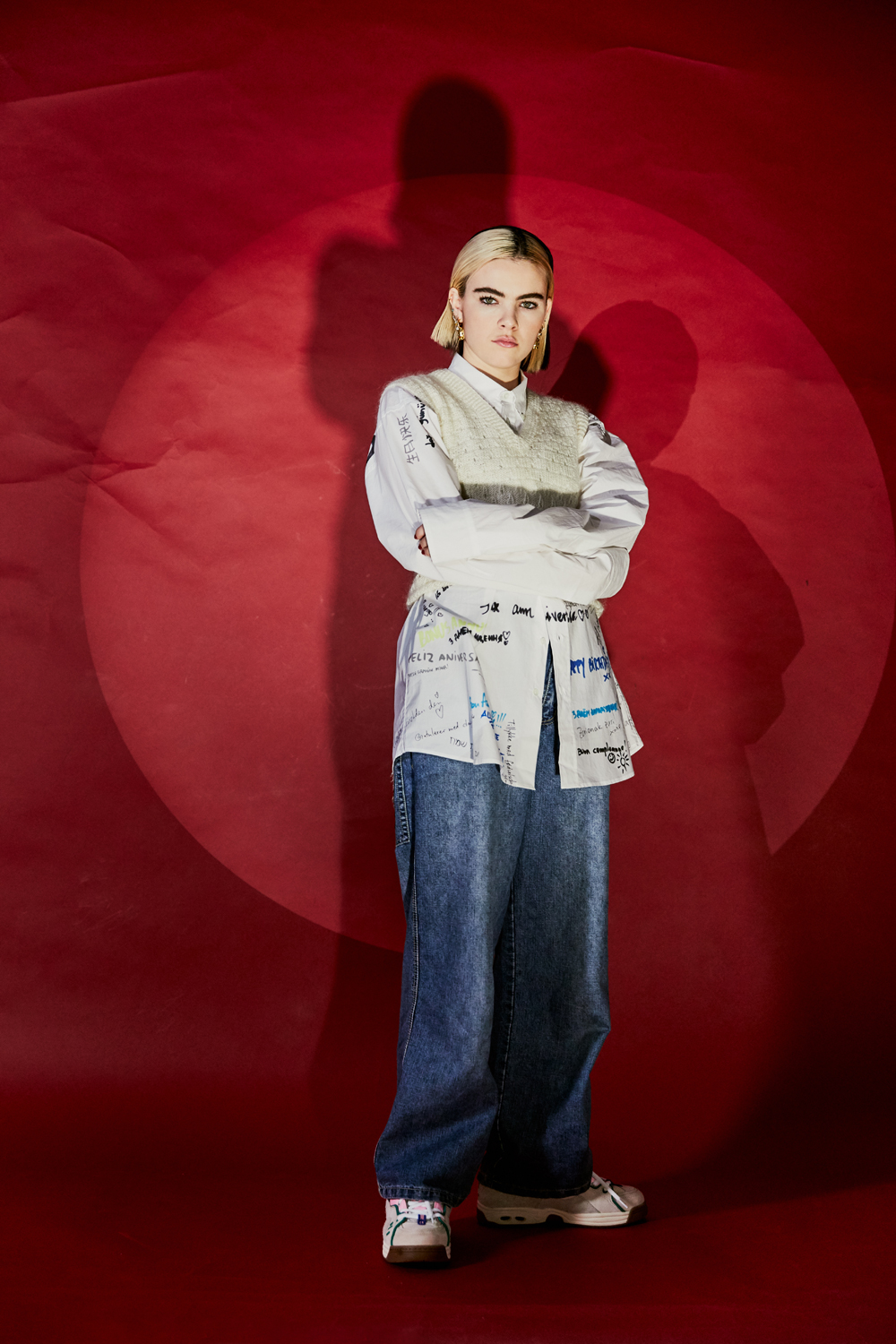 TOUGH GUY: Vetements shirt, $1160, from Zambesi. Benee wears own vintage vest and jeans. Photo / Frances Carter.