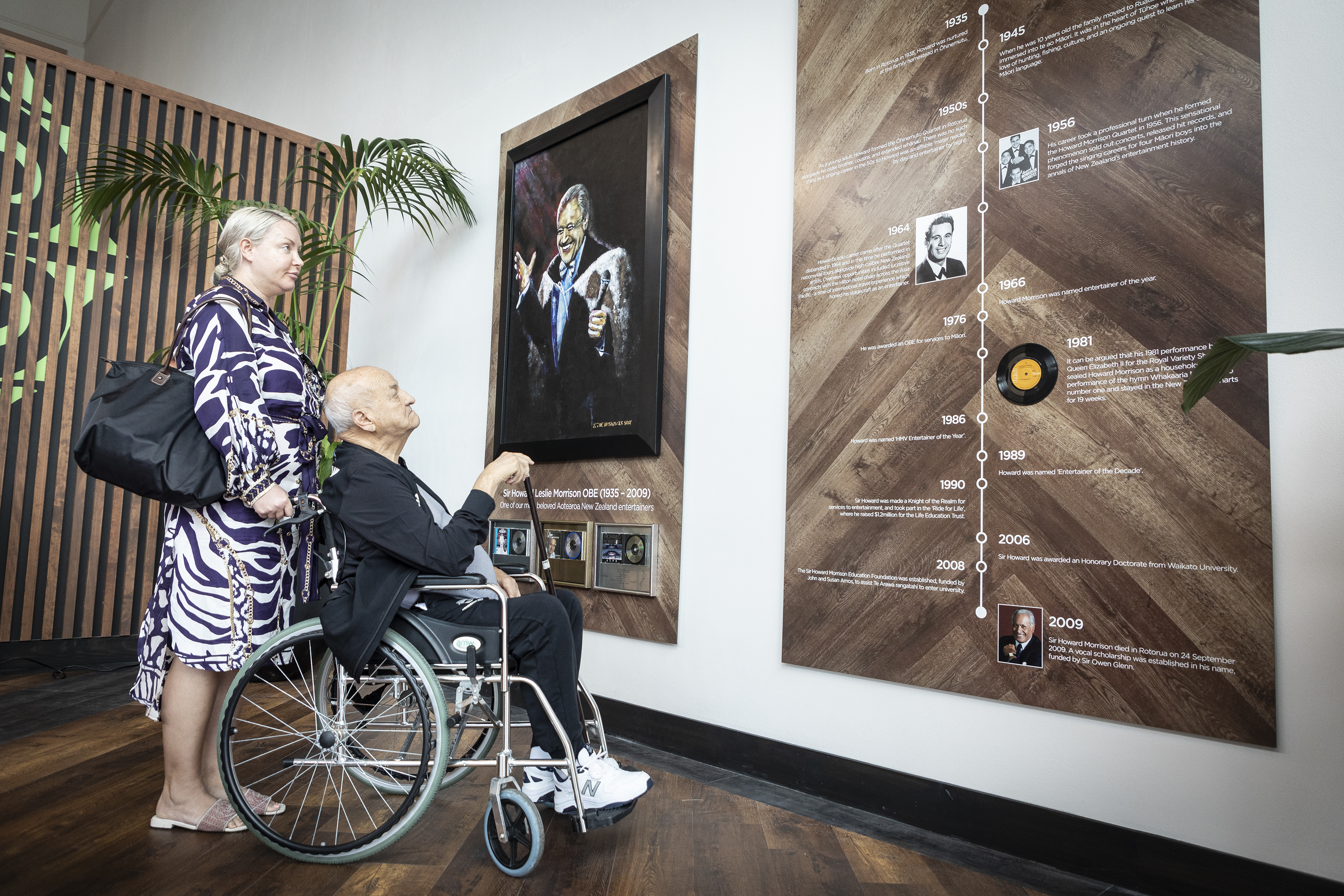 Sir Owen Glenn, pictured with Kate Herzberger, looks at a section about Sir Howard Morrison.  Photo / Andrew Warner.
