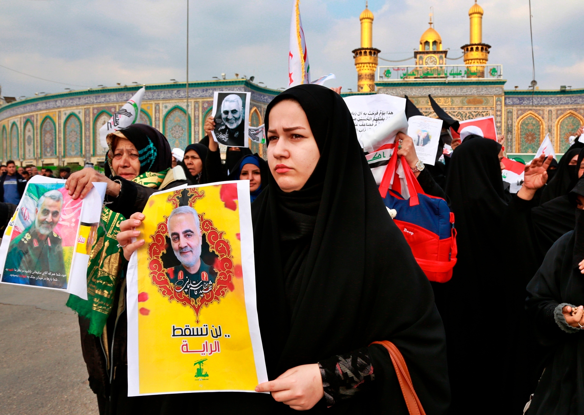 Shiite Muslims demonstrate over the US airstrike that killed Iranian Revolutionary Guard Gen. Qassem Soleimani, in the posters, in front of Imam Abbas in Karbala, Iraq. Photo / AP