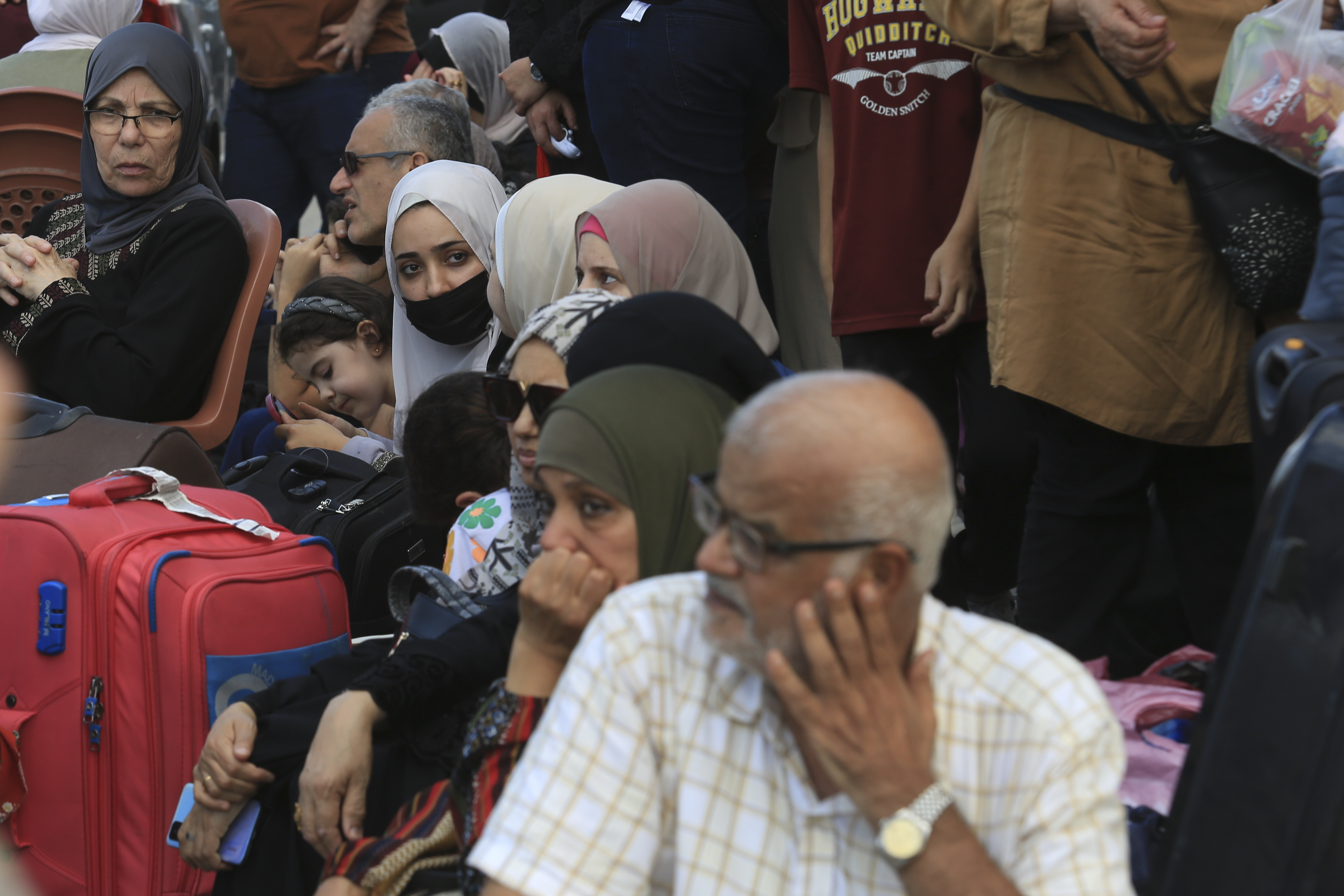 Palestinians wait at the Rafah border crossing between the Gaza Strip and Egypt Gaza Strip. Photo / AP