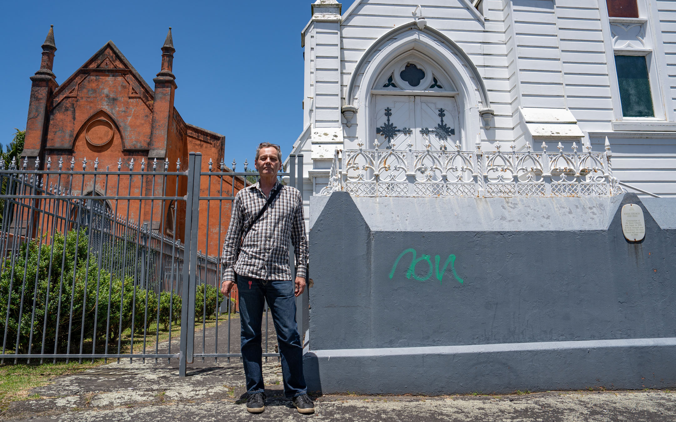 Waitemata Local Board member and heritage expert Allan Matson outside the Knox Church (right) and church hall (left) in Parnell, which are both for sale. Photo / Cameron Pitney