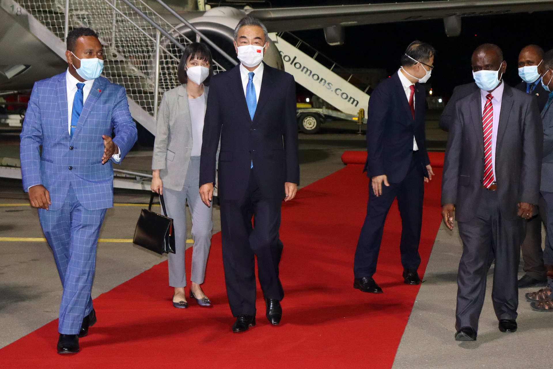 China's Foreign Minister, Wang Yi, centre, arrives in the Solomon Islands on May 26, the first leg of his Pacific tour. Photo / AP
