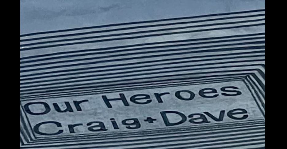 A tribute to firefighters Craig Stevens and Dr Dave Van Zwanenberg, who died while responding to reports of a landslide in Muriwai during Cyclone Gabrielle. Photo / Sand Art Man NZ