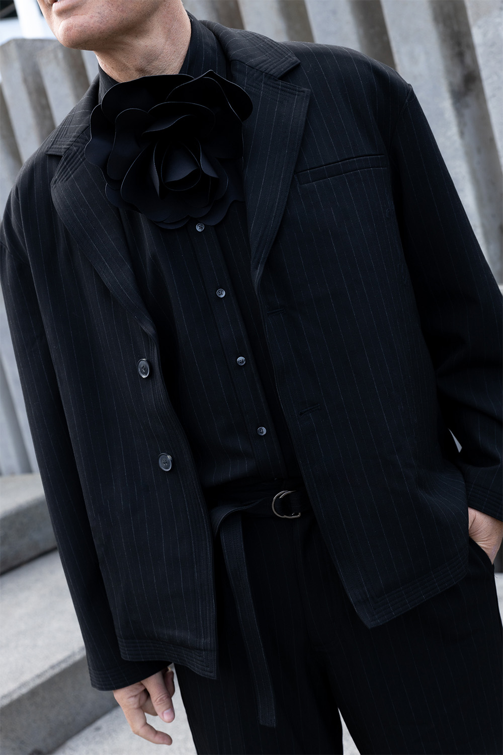 Beach Brains’ ‘Holiday Blazer’ with pleated pants and Mulligan’s own addition of a black flower. Photo / Katie Begbie