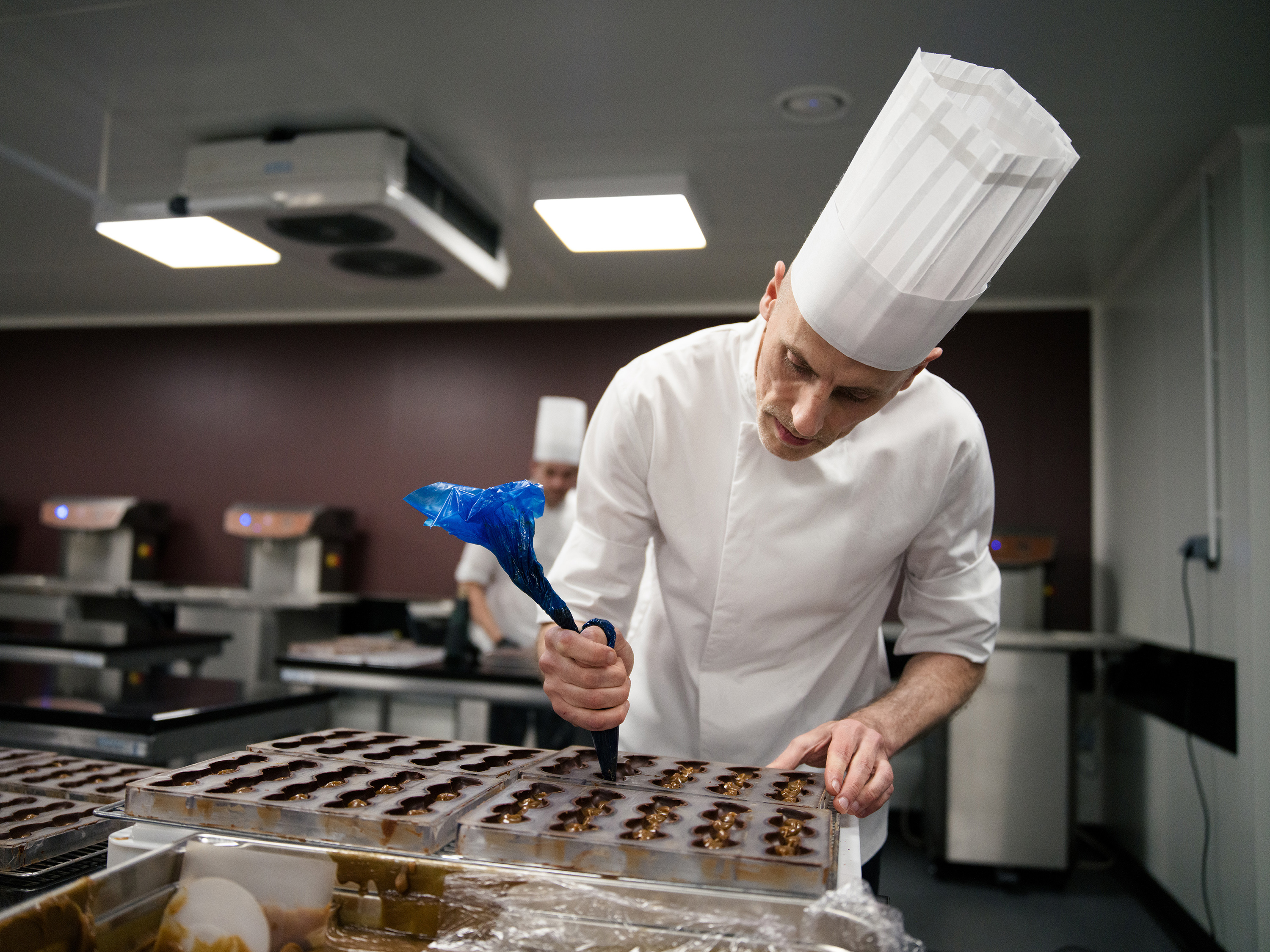 Much of the work involved in haute chocolaterie is still done by hand. Photo / Matthew Avignone, The New York Times