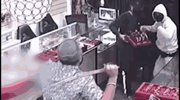 Man armed with sword defends Pooja Jewellers in Papatoetoe during armed robbery.