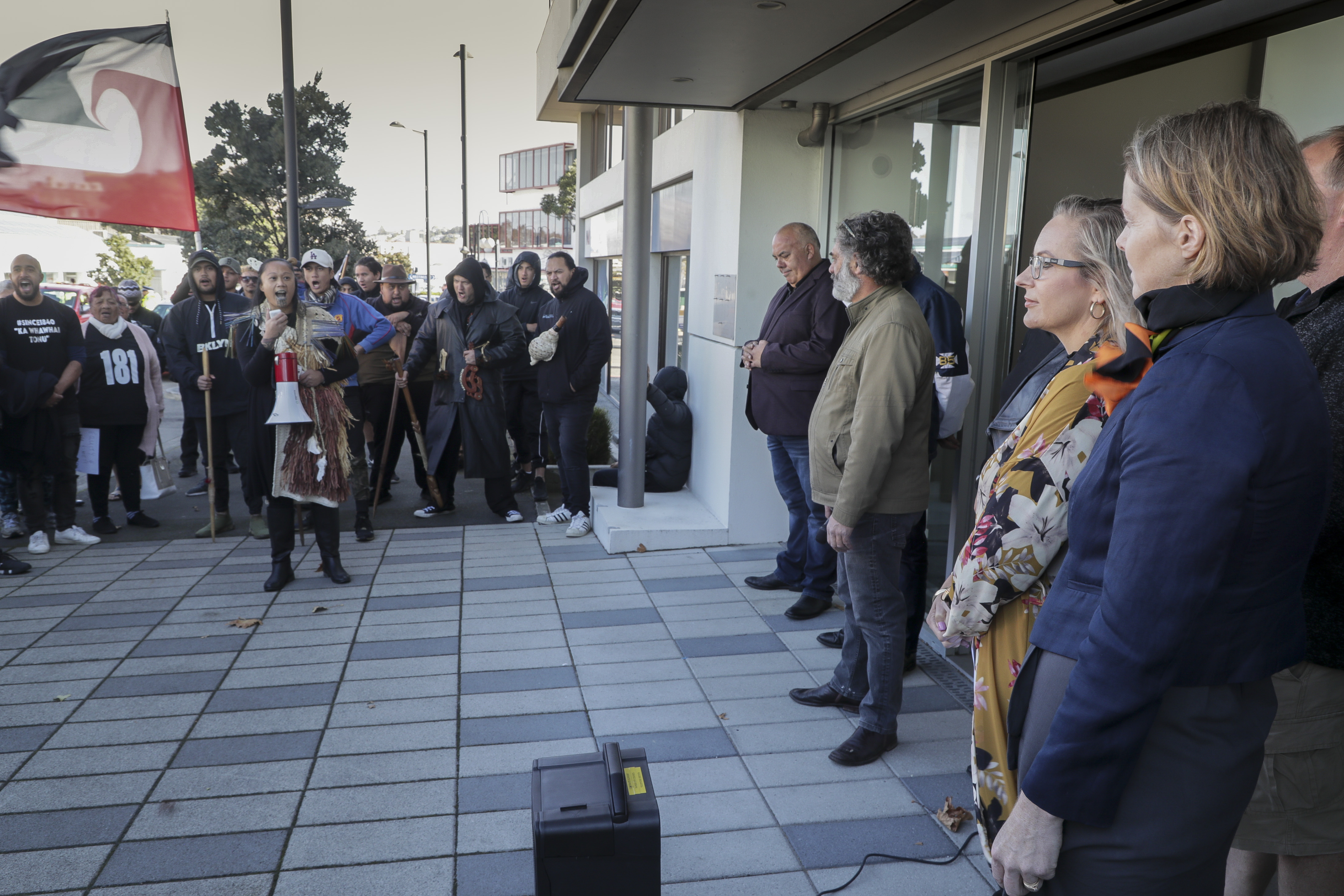 Napier mayor Kirsten Wise (second from right) listens at a protest in 2021 against a council decision not to establish a Māori ward at the 2022 elections. Photo / NZME