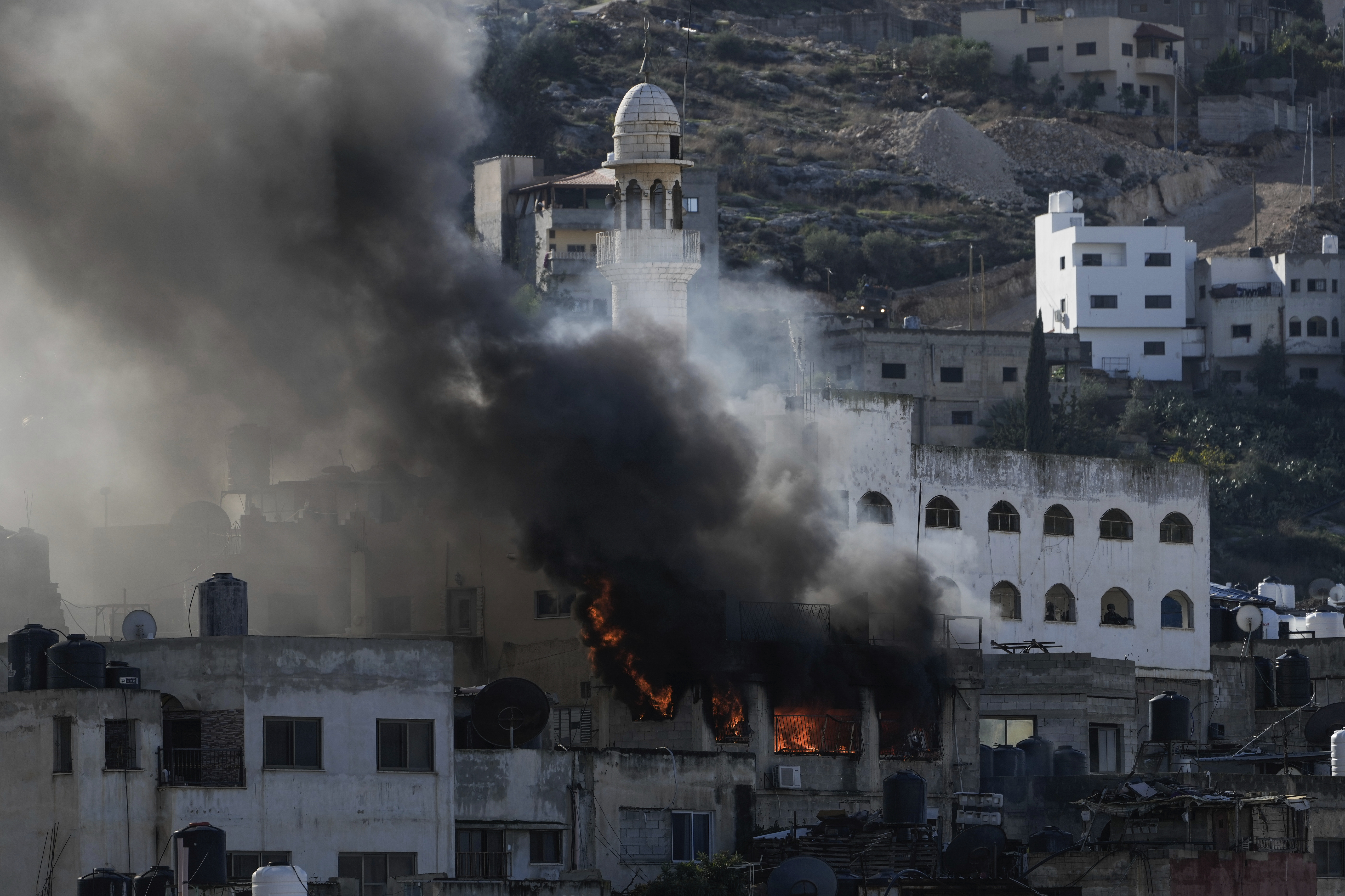 Fire and smoke rises during an Israeli army operation in Jenin, West Bank, on December 13. Photo / AP