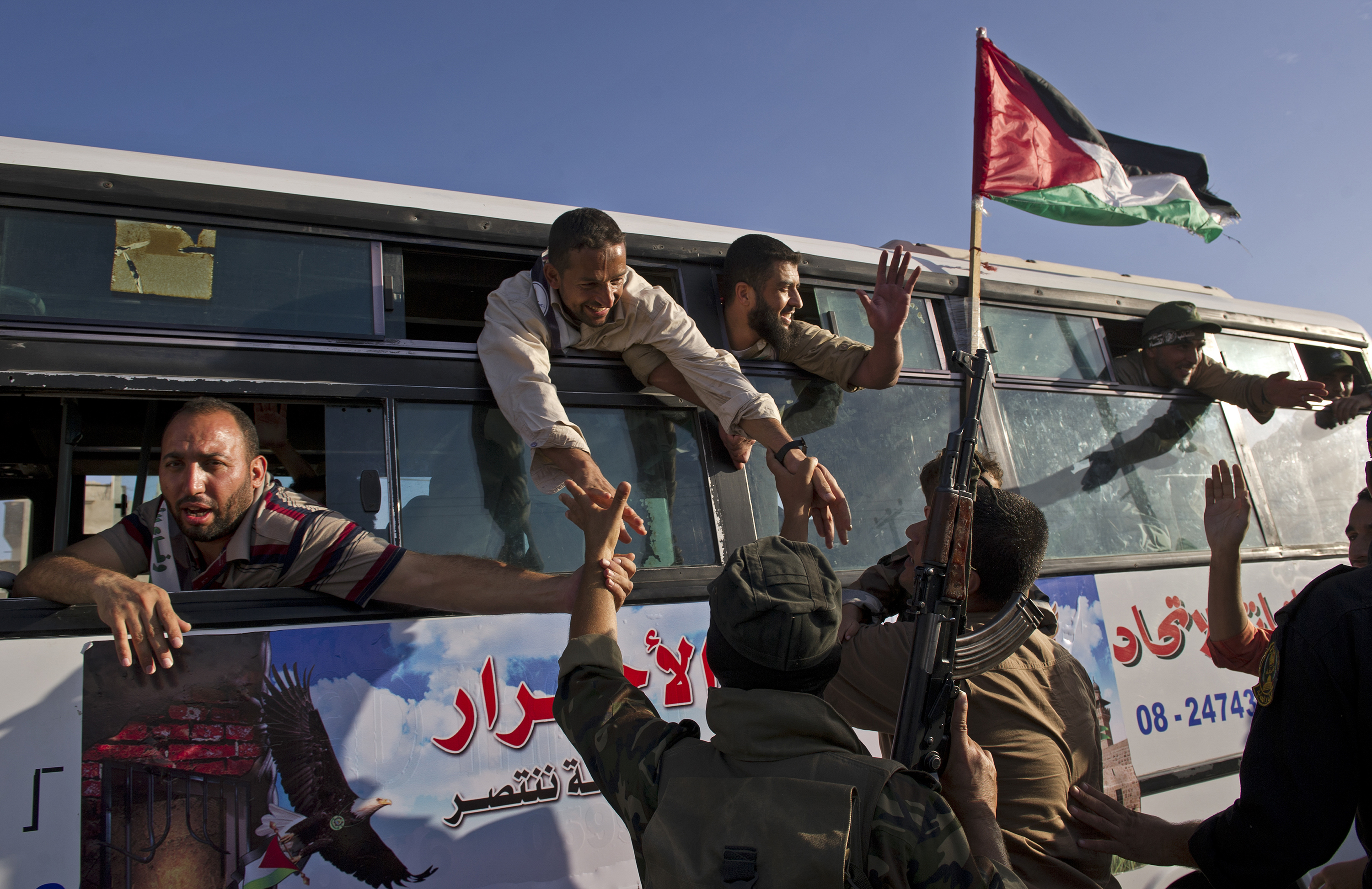 People lined the streets to greet dozens of prisoners as they travelled from Rafah to Gaza City after being released in exchange for the Israeli soldier Gilad Shalit in 2011. Photo / Lynsey Addario, The New York Times