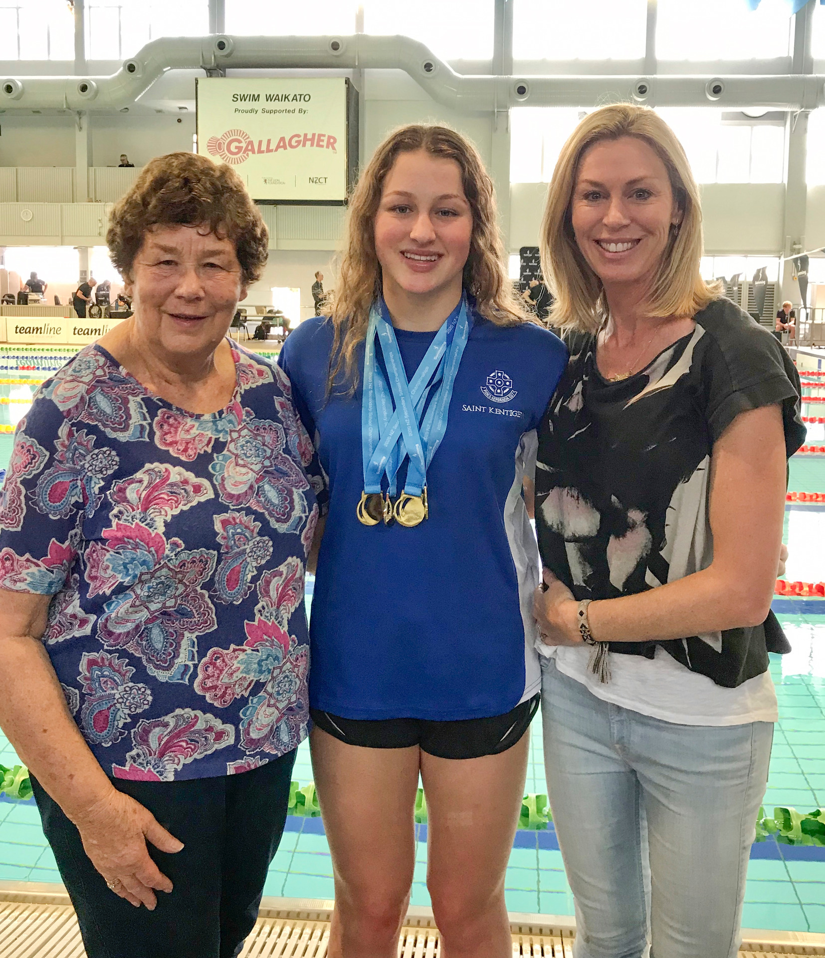 A proud Wendy with her mum Carole, pool-side with medal-winner Liv. Photo / Supplied