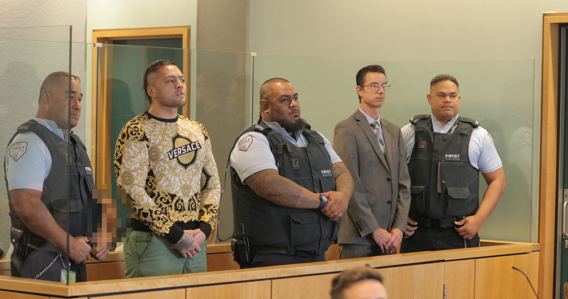 Tyson Daniels, wearing the gold Versace top, and Andrew Simpson at their High Court sentencing in February 2020. Photo / Michael Craig