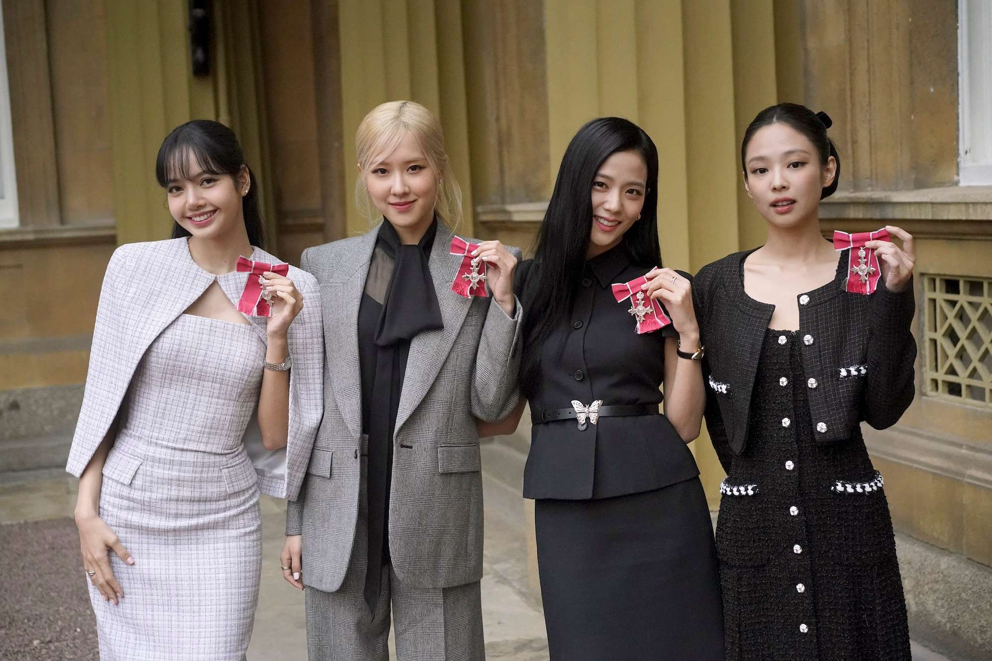 From left, Lisa (Lalisa Manoban), Rose (Roseanne Park), Jisoo Kim and Jennie Kim, from the K-Pop band Blackpink pose with their Honorary MBEs, Members of the Order of the British Empire, awarded to them in recognition of the band's role as COP26 advocates for the COP26 Summit in Glasgow 2021, in London. Photo / AP