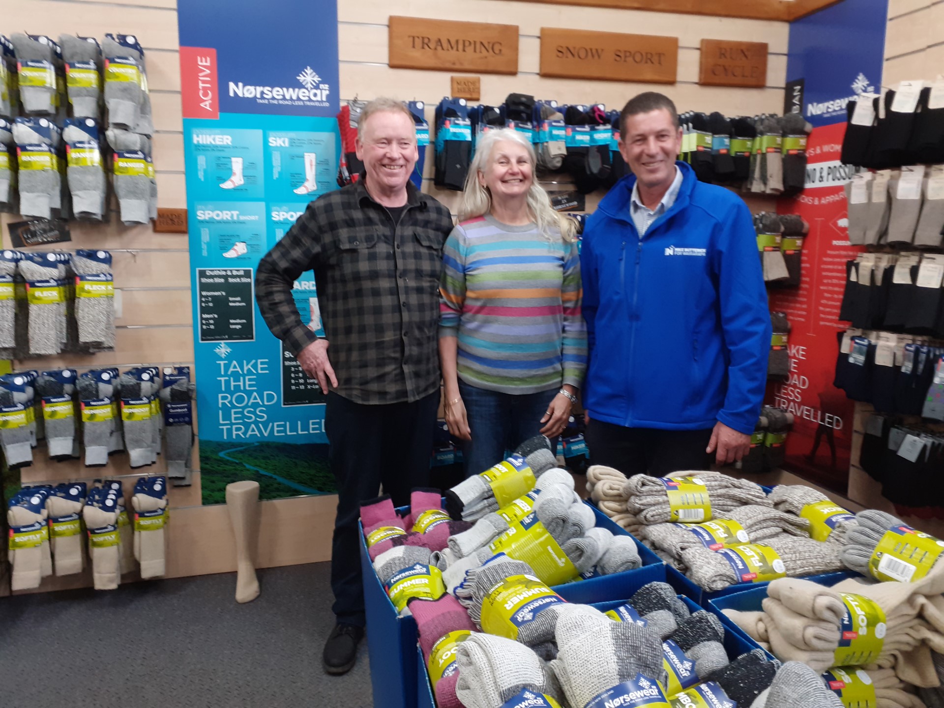New Zealand Natural Clothing owners Phil Grant and Julie Hedley with Wairarapa's National candidate Mike Butterick. Photo / Sue Emeny