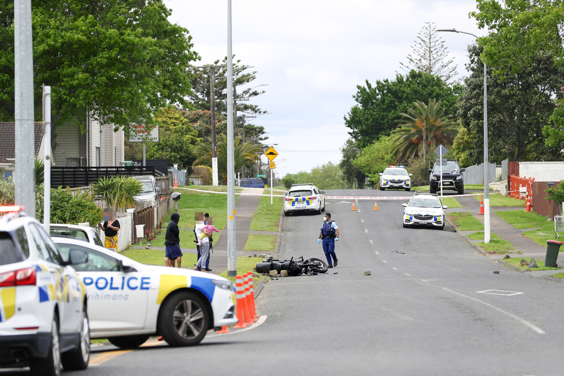 Police at Mangere East in late October after a gang member was allegedly run off his motorbike before gunshots were heard. Photo / Hayden Woodward