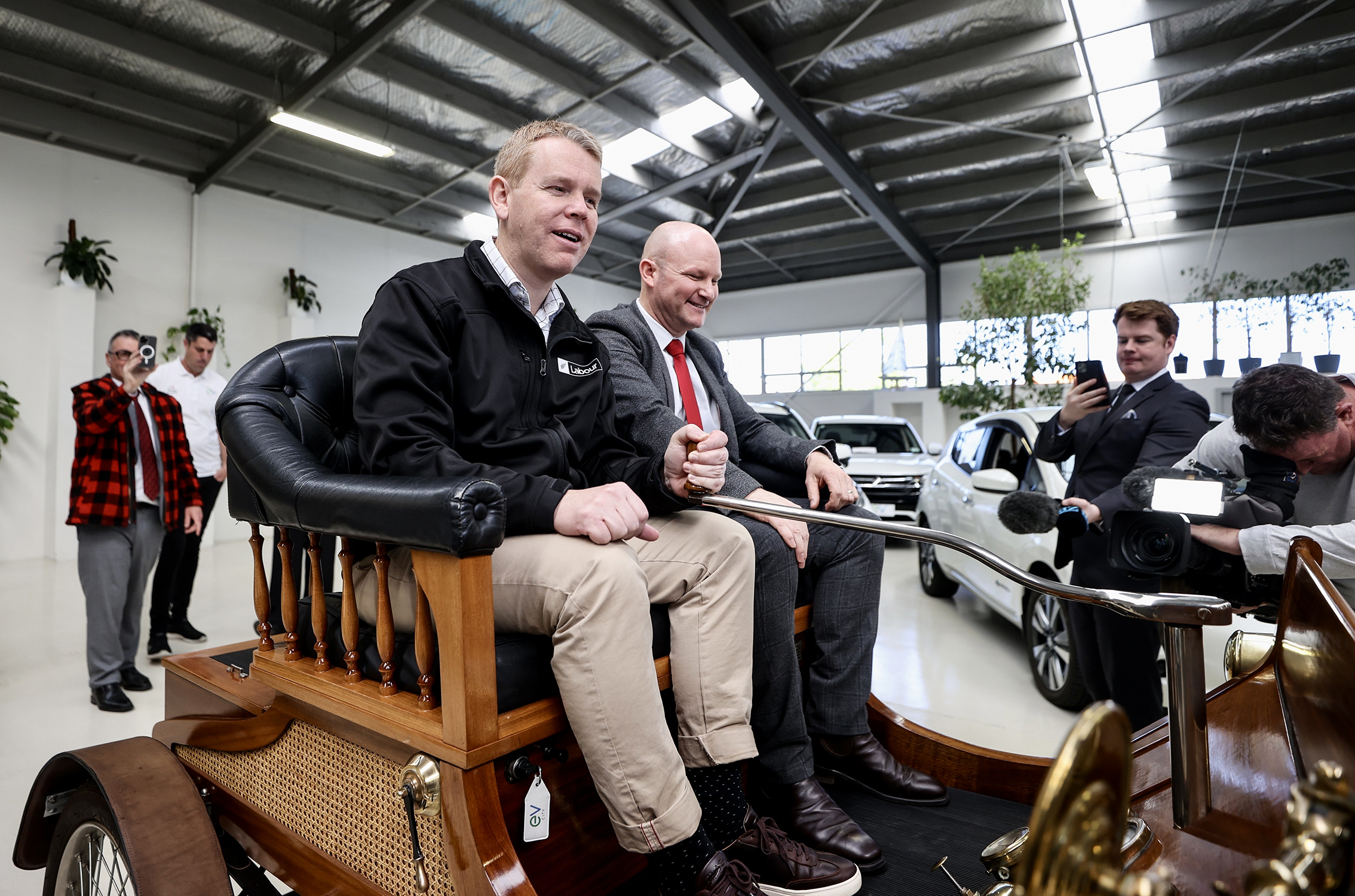 Labour Party leader Chris Hipkins at EV City in Christchurch with the first ever electric vehicle built in 1903. Photo / George Heard 