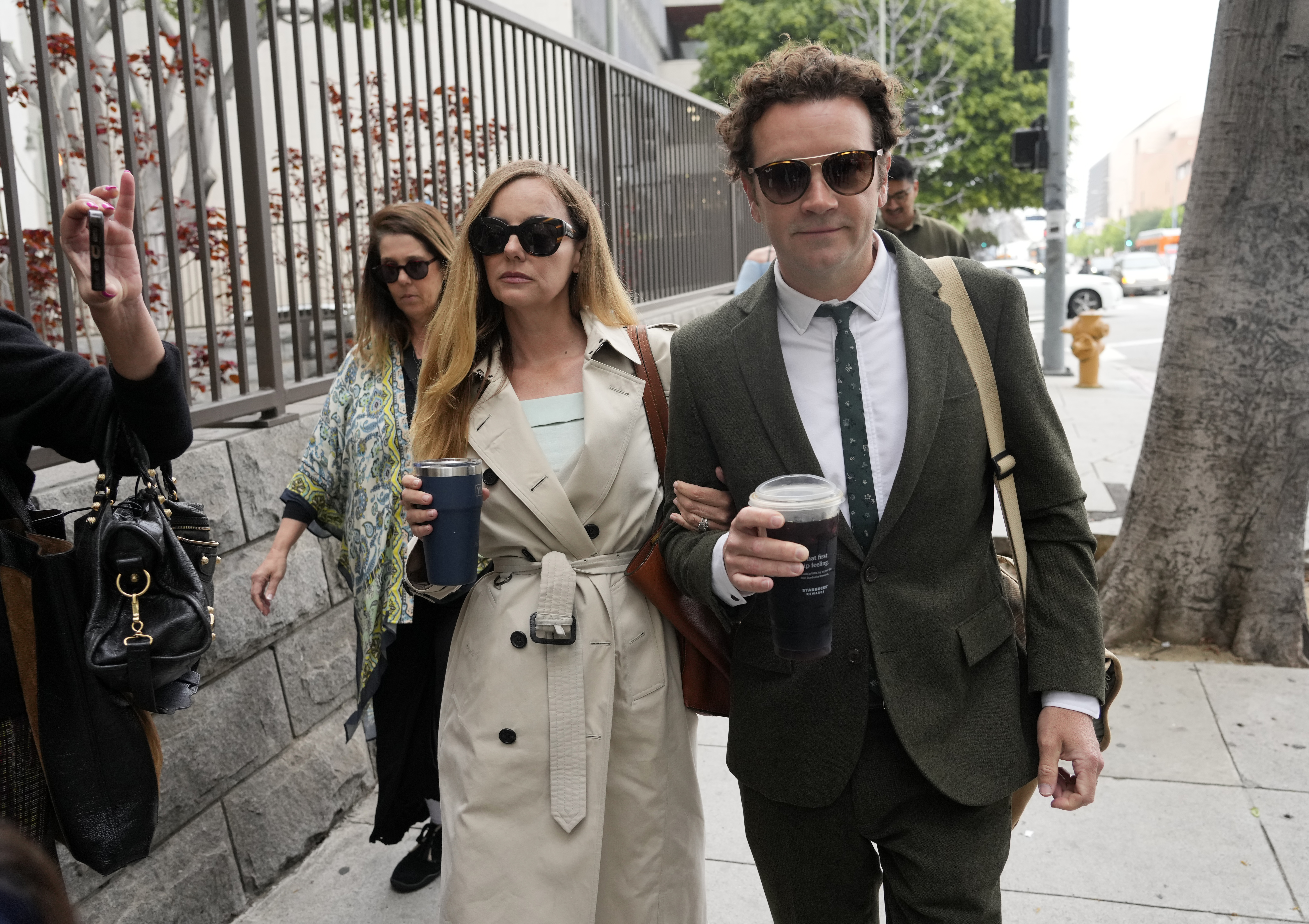 Danny Masterson, right, and his wife Bijou Phillips arrive for closing arguments in his second trial, May 16, 2023. Photo / AP