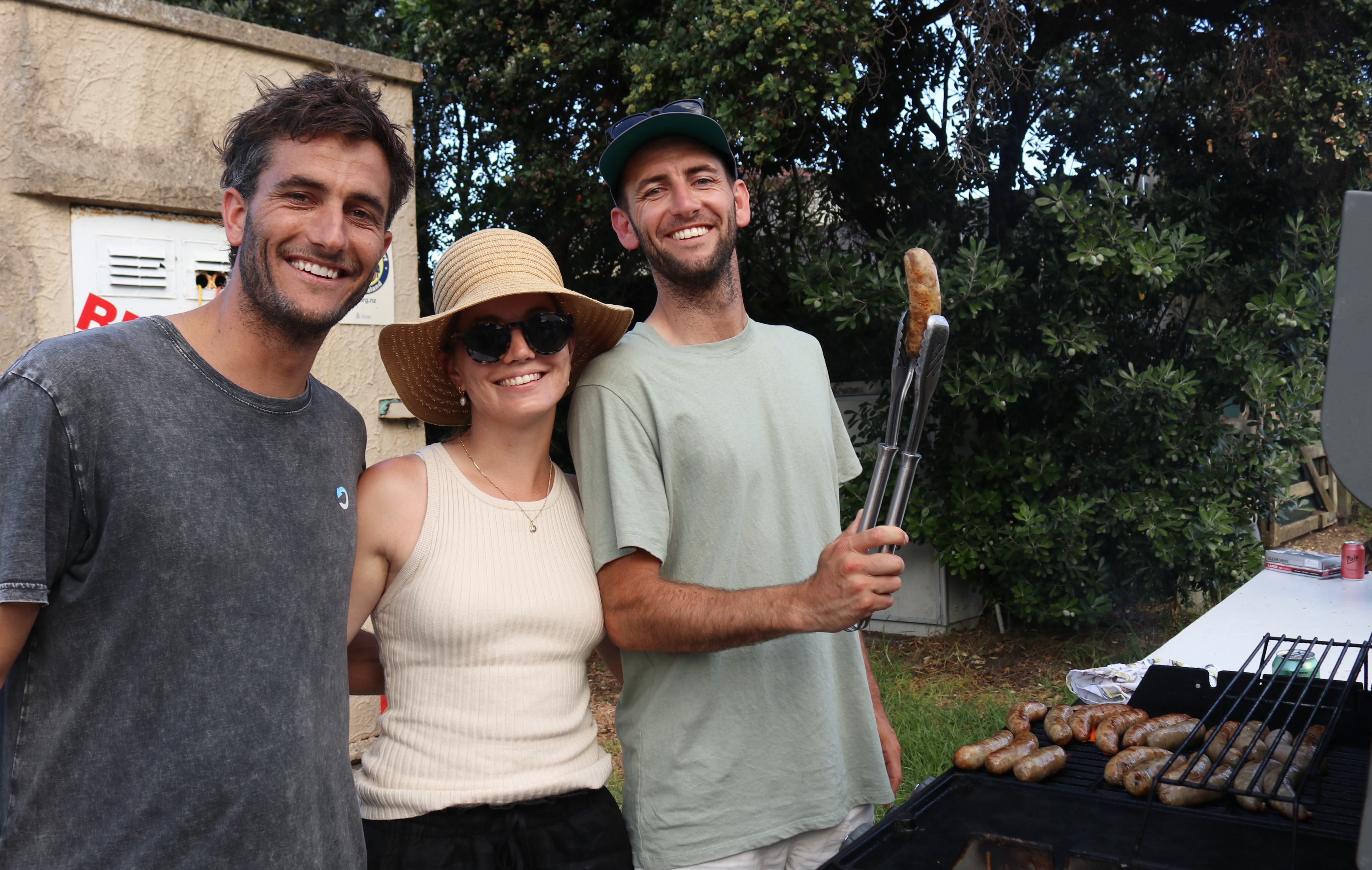 Even the Tractor Spectacular sausage sizzle crew had star power. (From left): Olympic gold medallist and team NZ sailor Blair Tuke, Julia Campbell, and Celebrity Treasure Island winner Jesse Tuke. Photo / Peter de Graaf