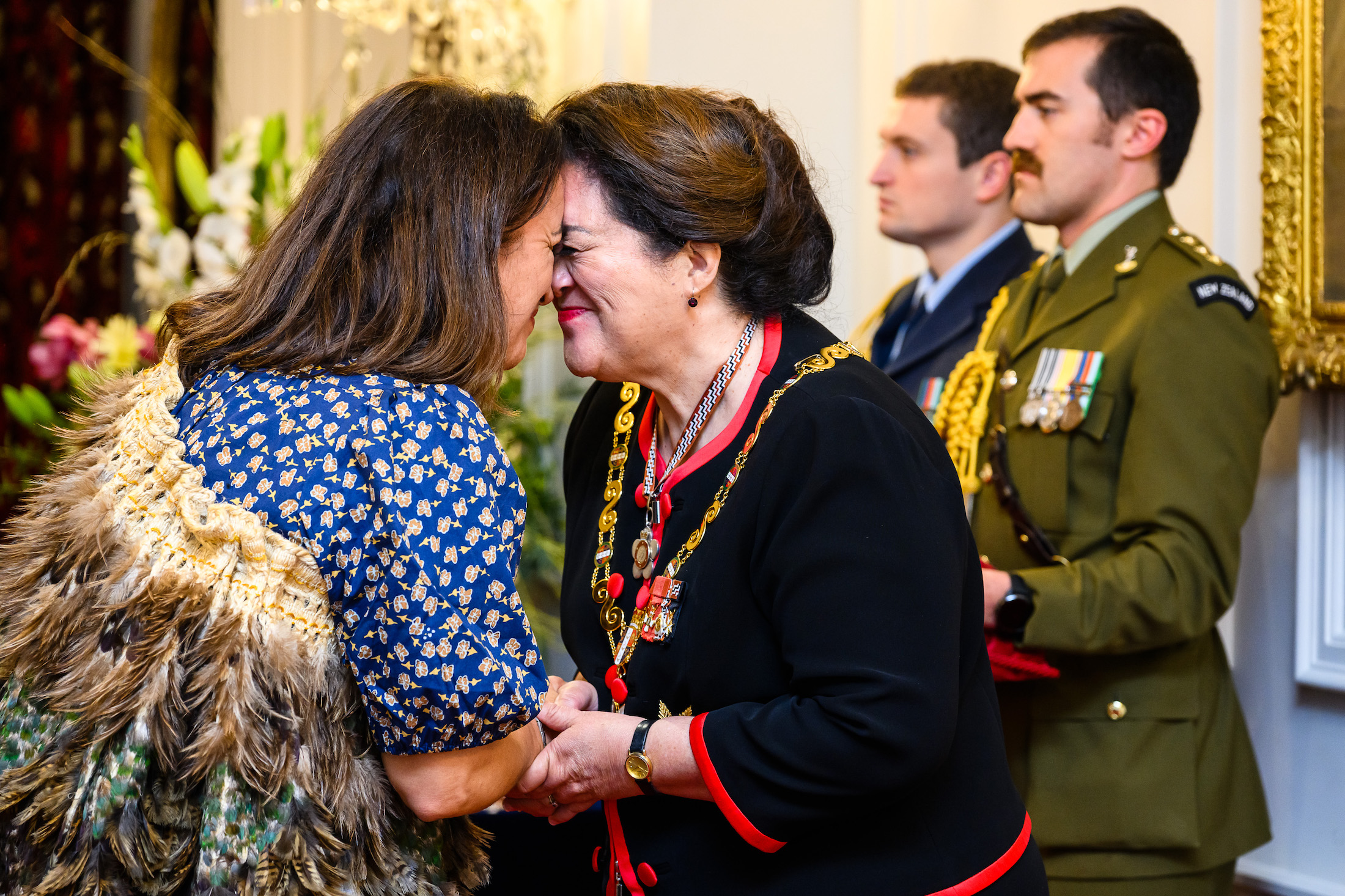 Dame Farah Palmer shares a hongi with Governor-General Dame Cindy Kiro. Photo / Mark Coote, www.photosport.nz