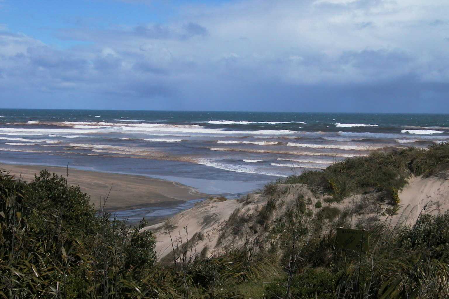 Rough surf out at Baylys Beach can create hazards for swimmers. Photo / File