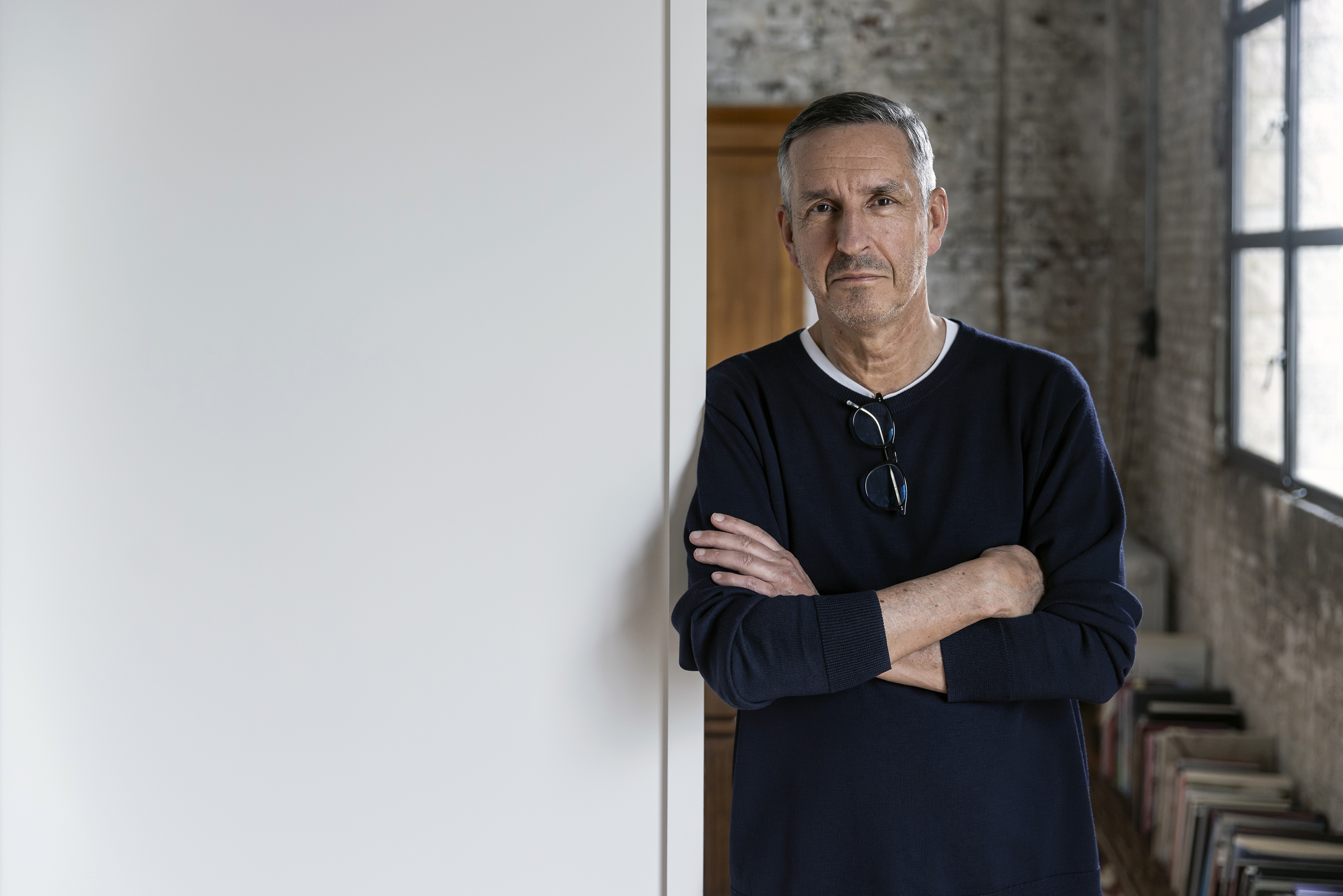 Designer Dries Van Noten in the sprawling old warehouse that houses his Antwerp headquarters. Photo / New York Times