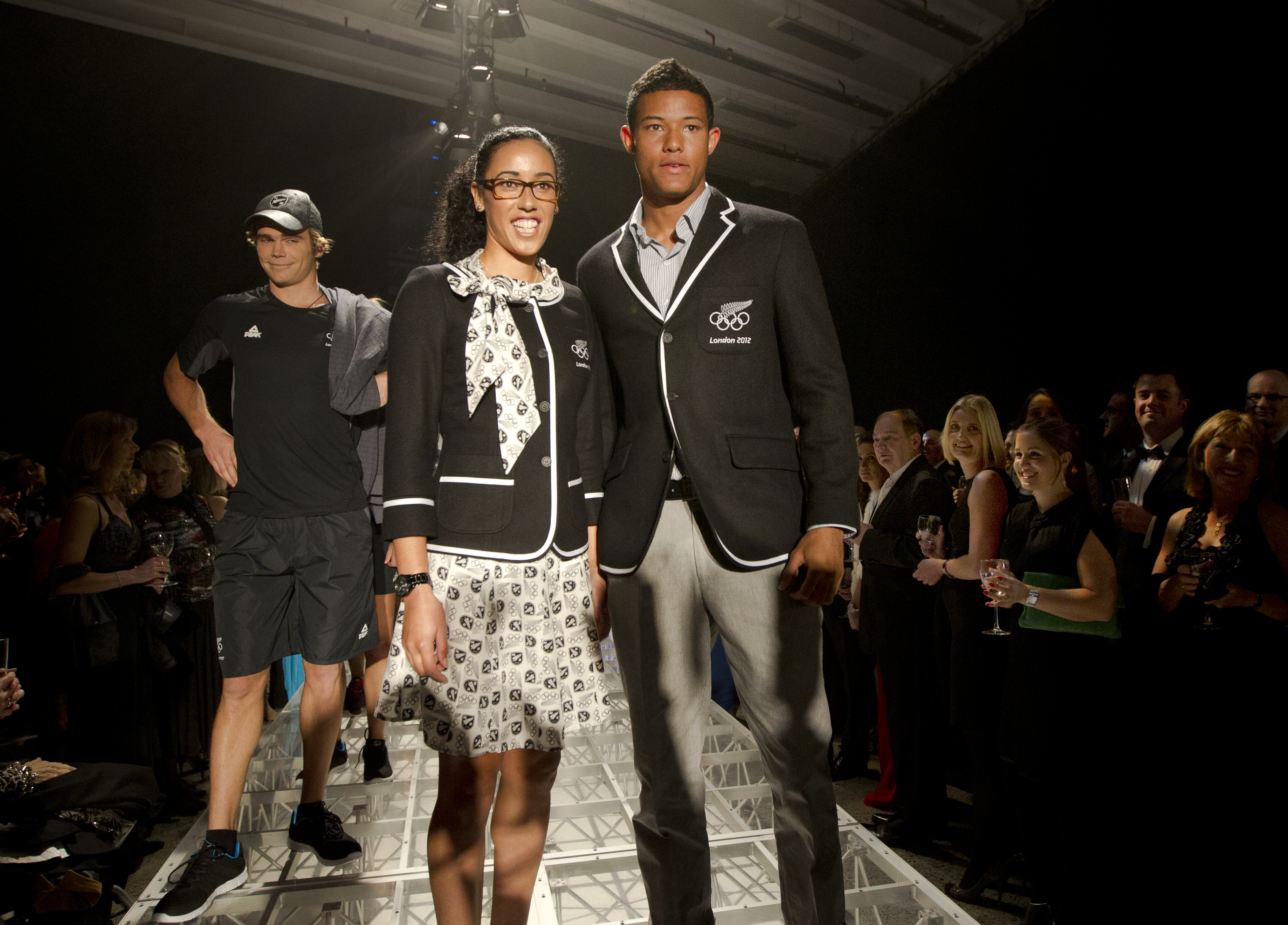 Hockey player Melody Cooper (centre) and football player James Musa (right) modelling the New Zealand Olympic team's formal uniform in 2012. Photo / Brett Phibbs