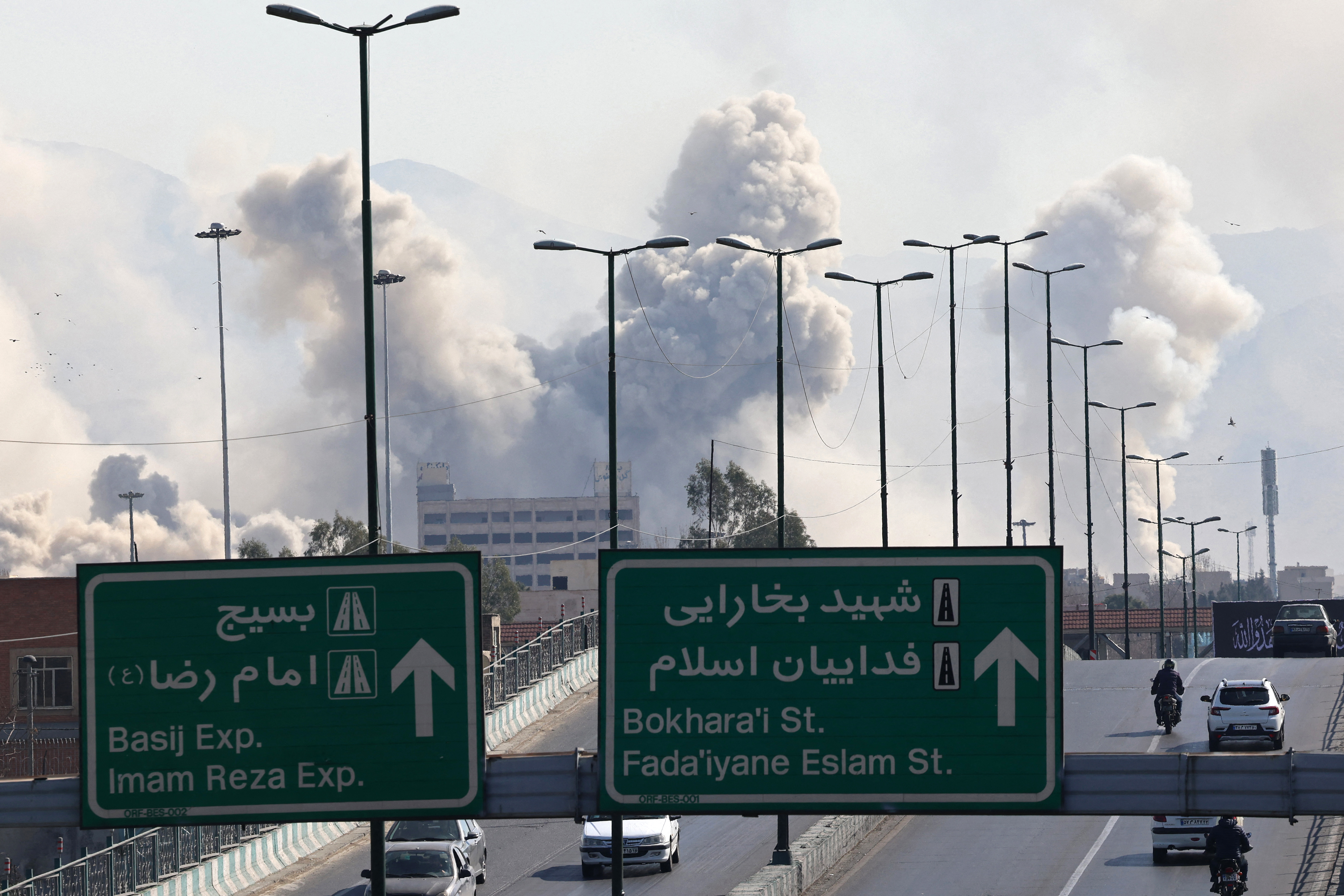 Smoke rises after a military strike on the Iranian capital of Tehran on Thursday, with conflict in the Middle East impacting global fuel prices. Photo / Atta Kenare, AFP