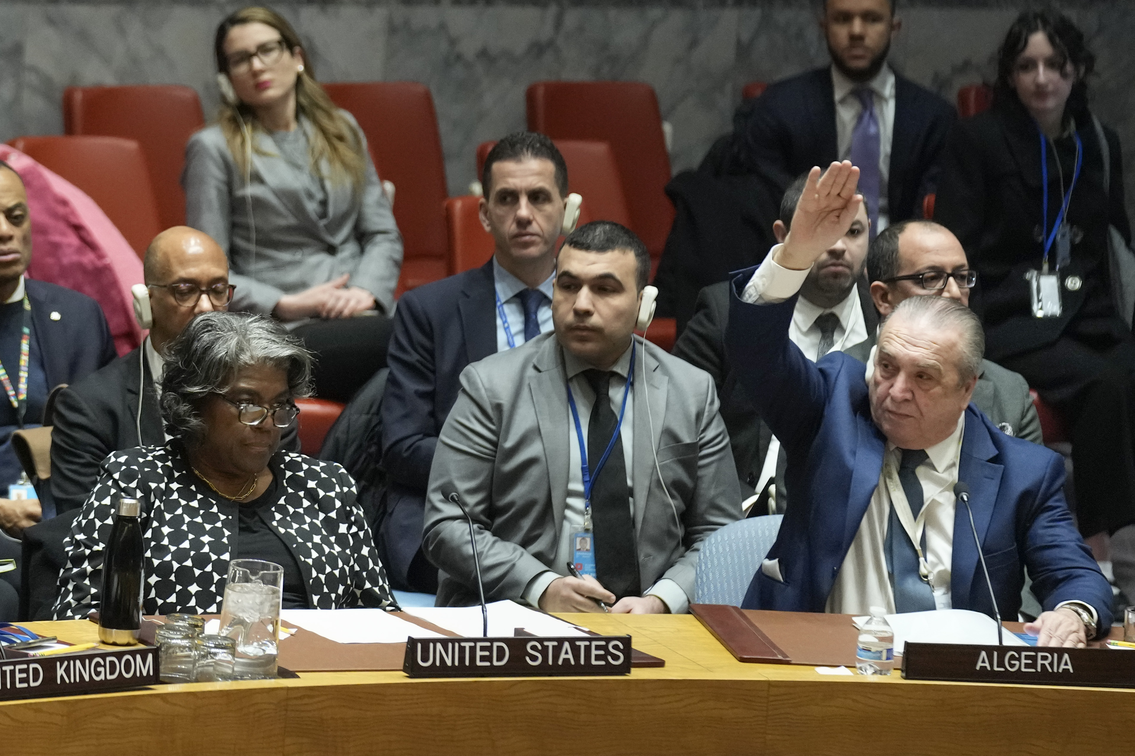 Algerian Ambassador to the United Nations Amar Bendjama, right, votes to approve a resolution concerning a ceasefire in Gaza. Photo / AP