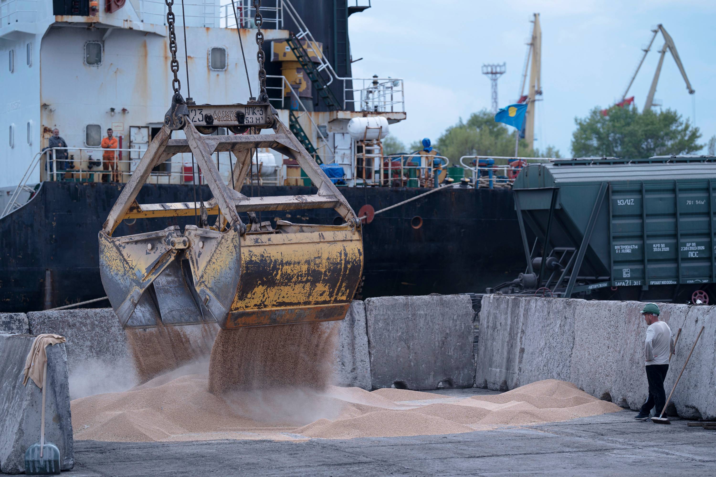 Workers load grain at a grain port in Izmail, Ukraine, in April. Photo / AP