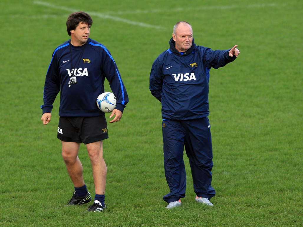 Sir Graham Henry and coach Santiago Phelan talk during an Argentina training session. Photo / Getty Images
