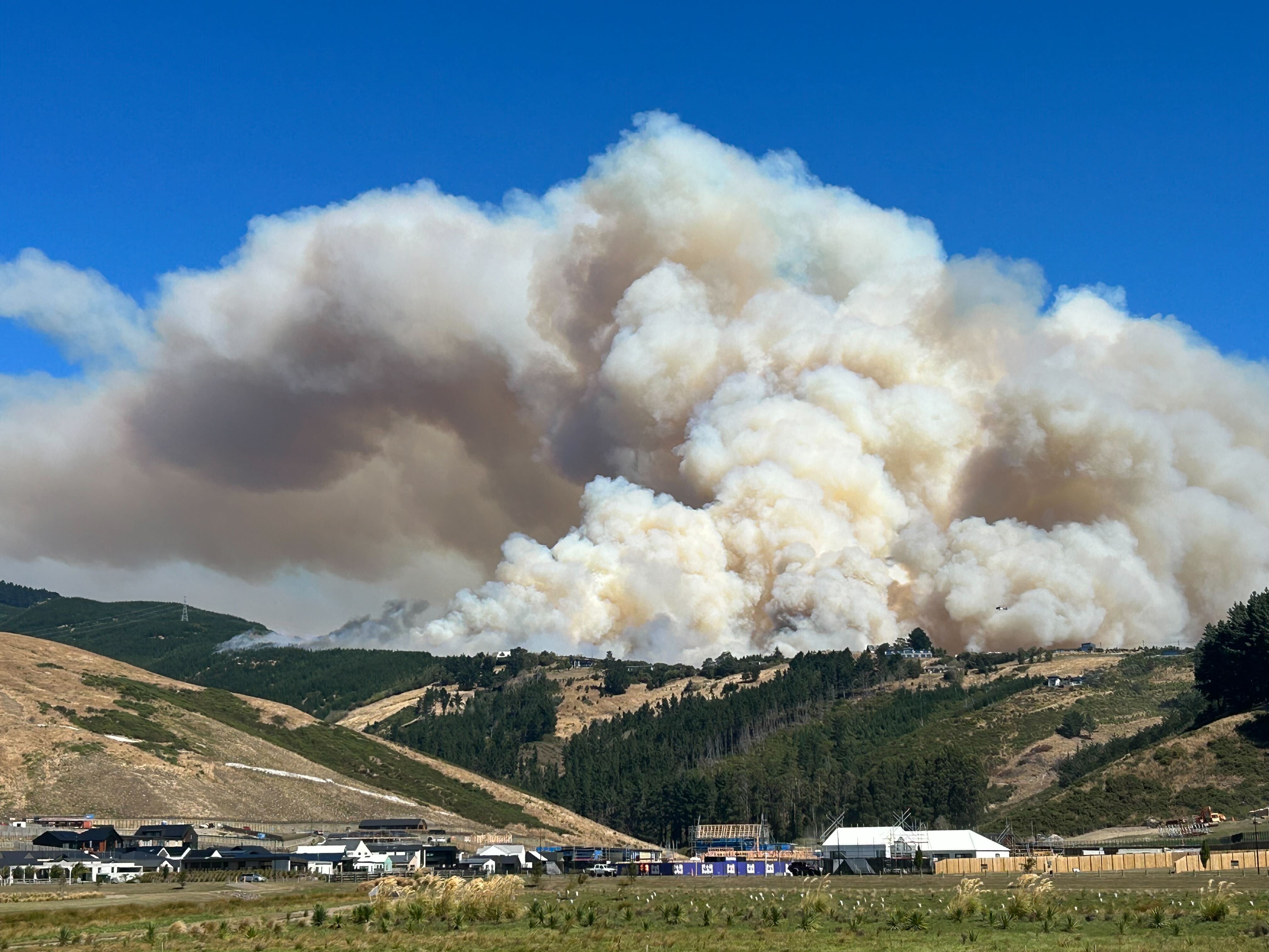 Smoke billowed from the fire, seen here on Wednesday. Photo / Pierre Nixon