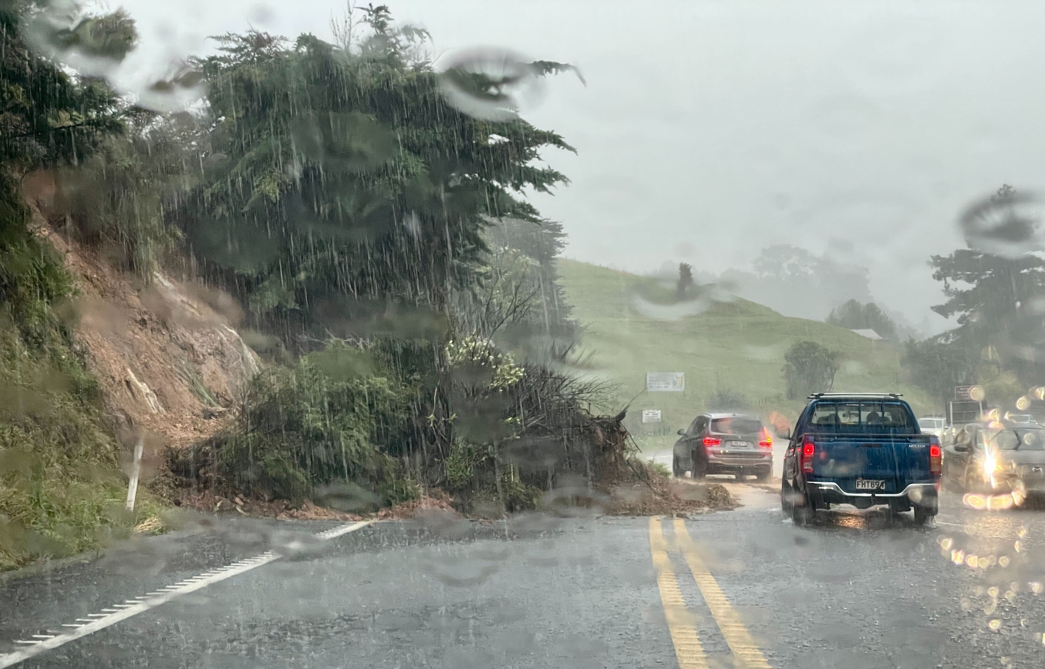 At least four slips blocking SH1 southbound at Pohuehue, north of Auckland. Photo / Jed Bradley