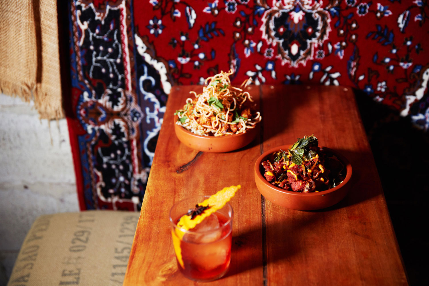 The bang bang chicken (left) and kurryaage spiced chicken on the menu at Satya. Photo / Rebecca Zephyr Thomas 