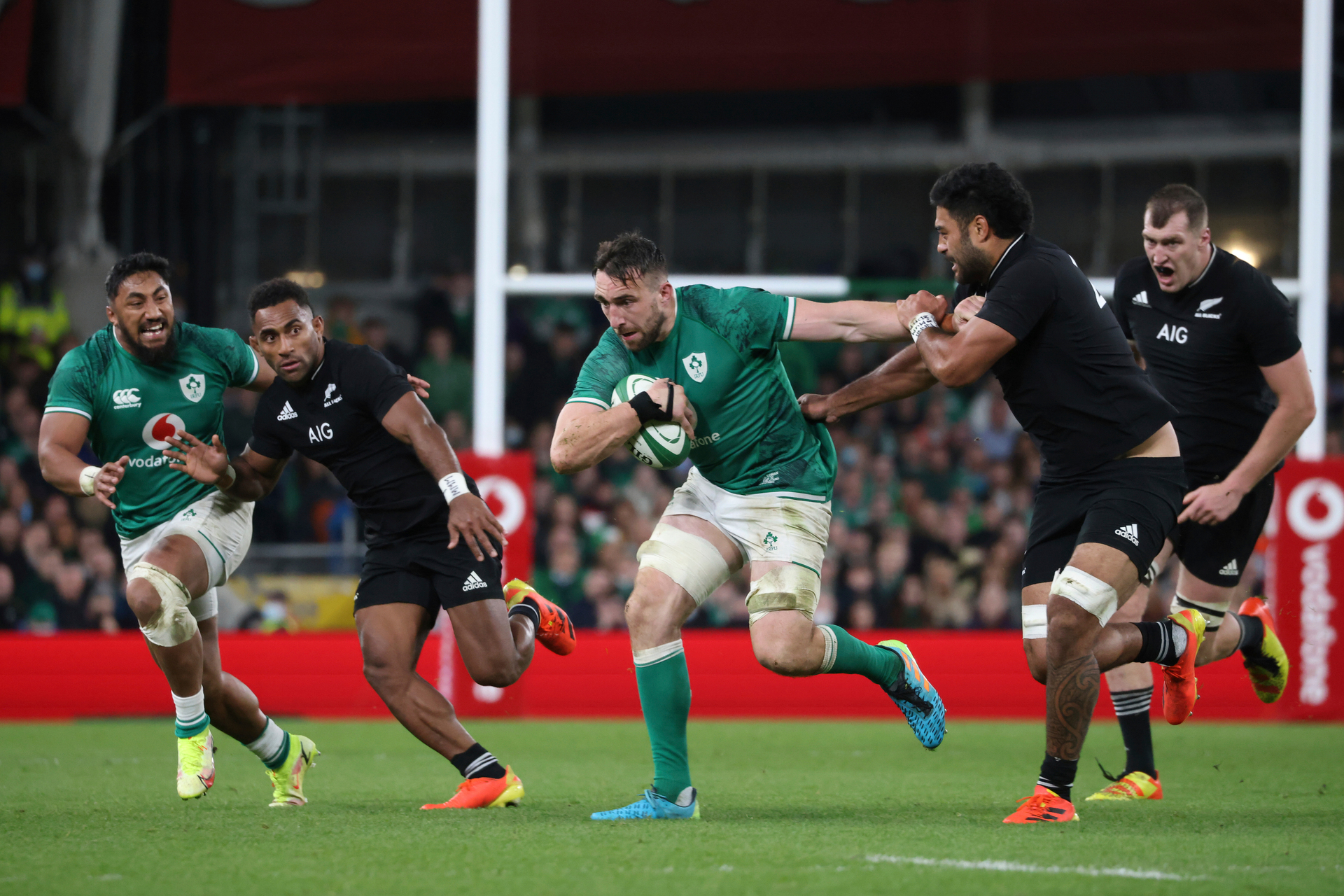 Ireland's Jack Conan, center, holds off New Zealand's Akira Ioane during the international rugby union match between Ireland and New Zealand.  Photo / AP