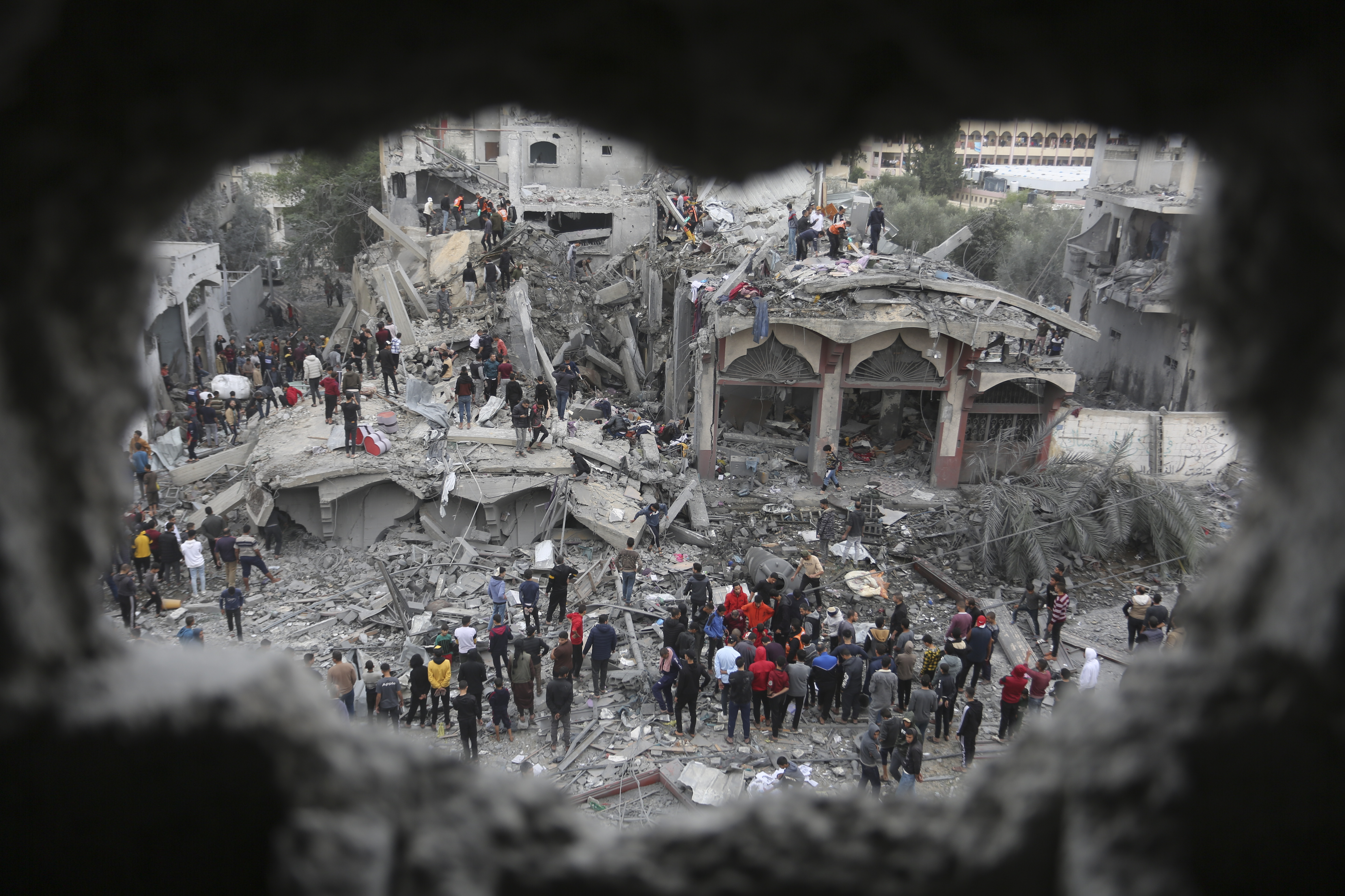 Palestinians search for survivors of the Israeli bombing in Rafah, Gaza Strip. Photo / AP