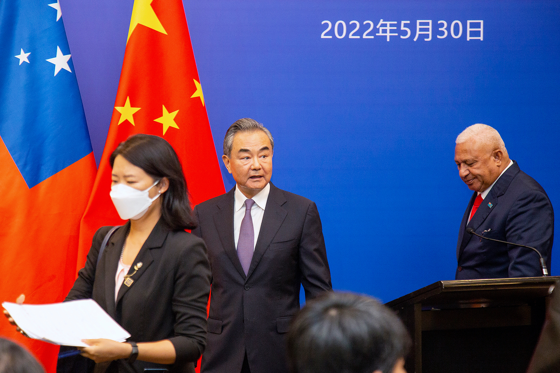China's Foreign Minister Wang Yi (left) appears on stage at the Pacific Islands Foreign Ministers' meeting with Fiji Prime Minister Frank Bainimarama. Photo / AP