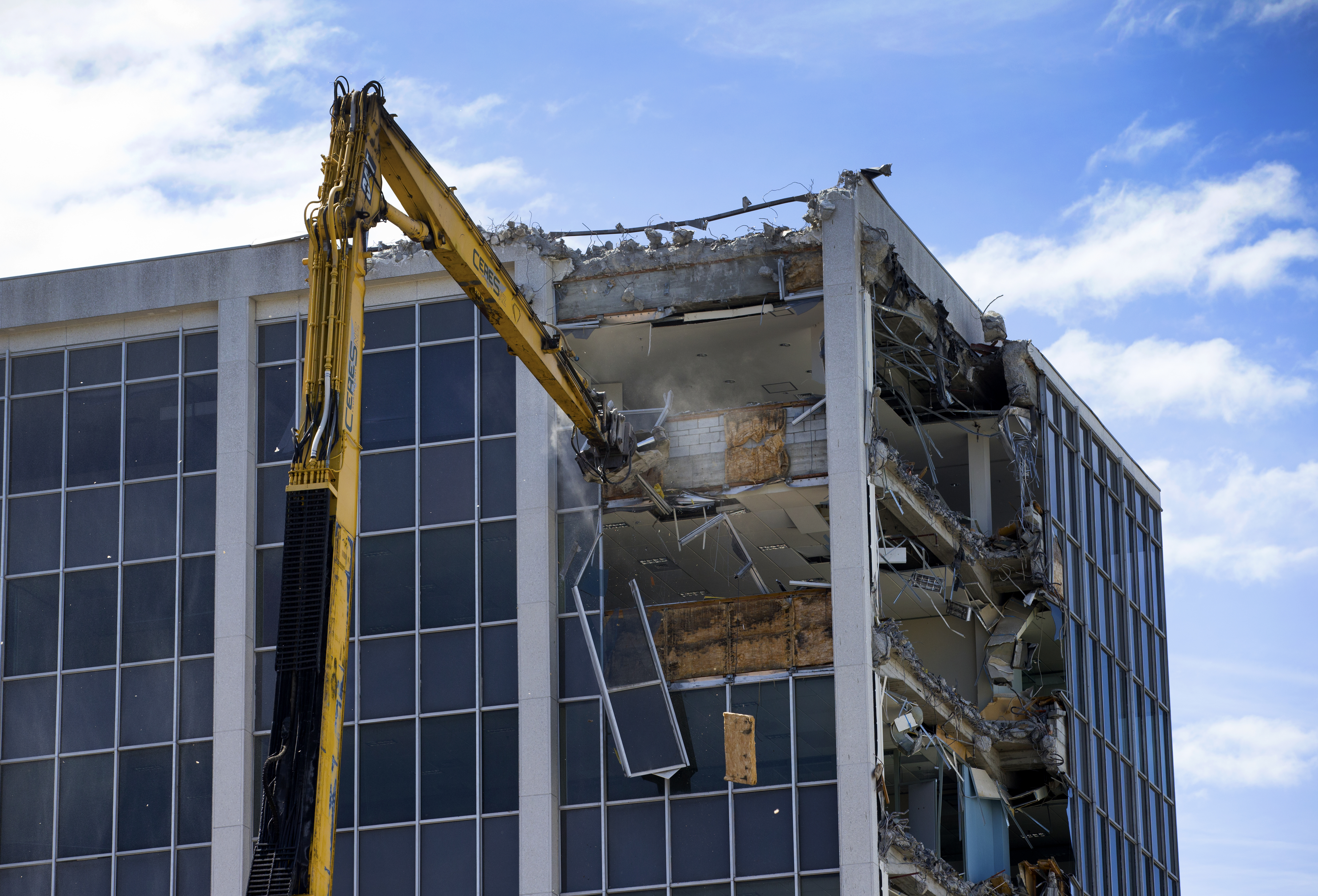 The 85-ton excavator at work on the demolition of 61 Molesworth Street in Wellington. Photo / Mark Mitchell