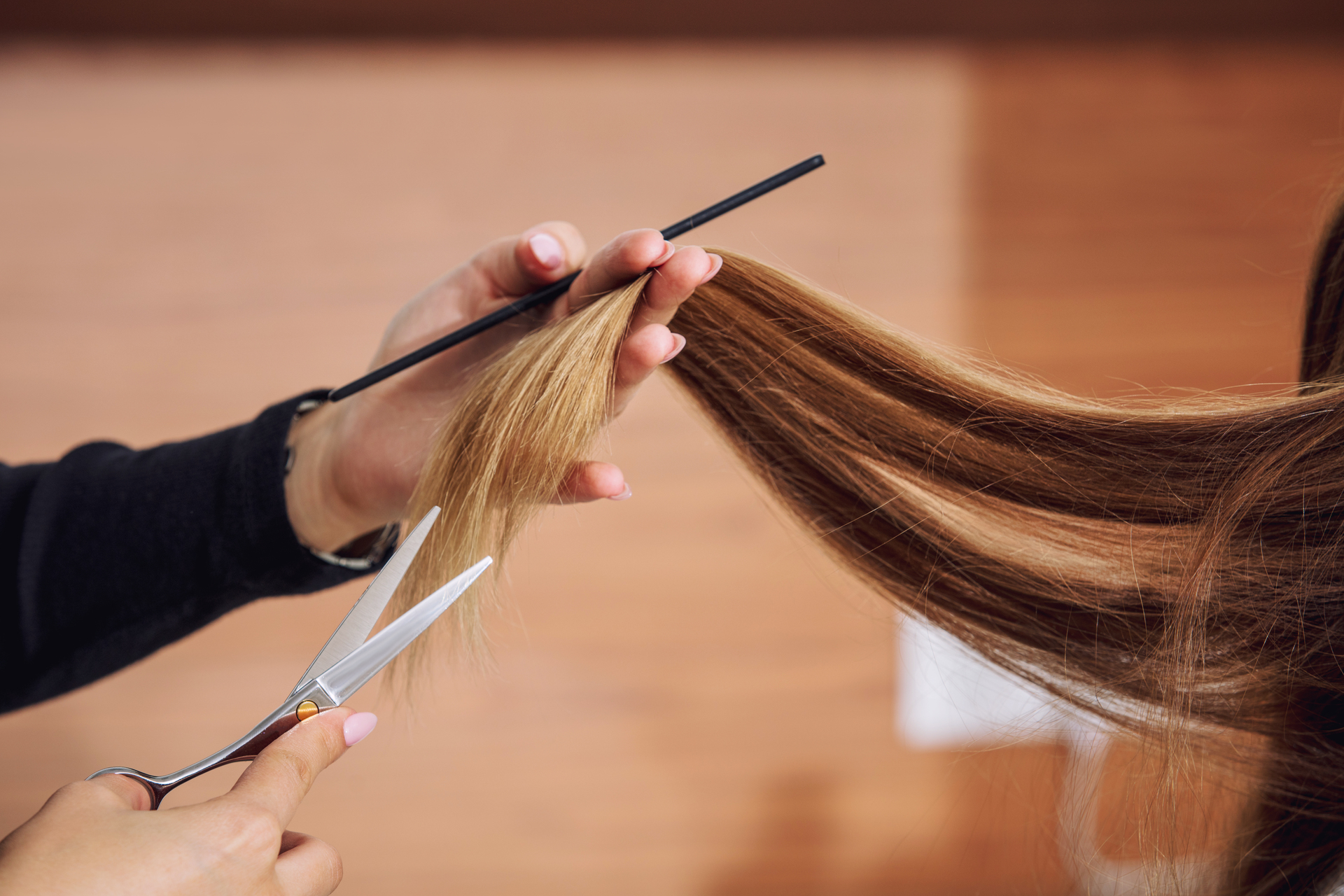 Visits to the hairdresser are getting the snip as more New Zealanders struggle to get to the next paycheck. Photo / 123rf