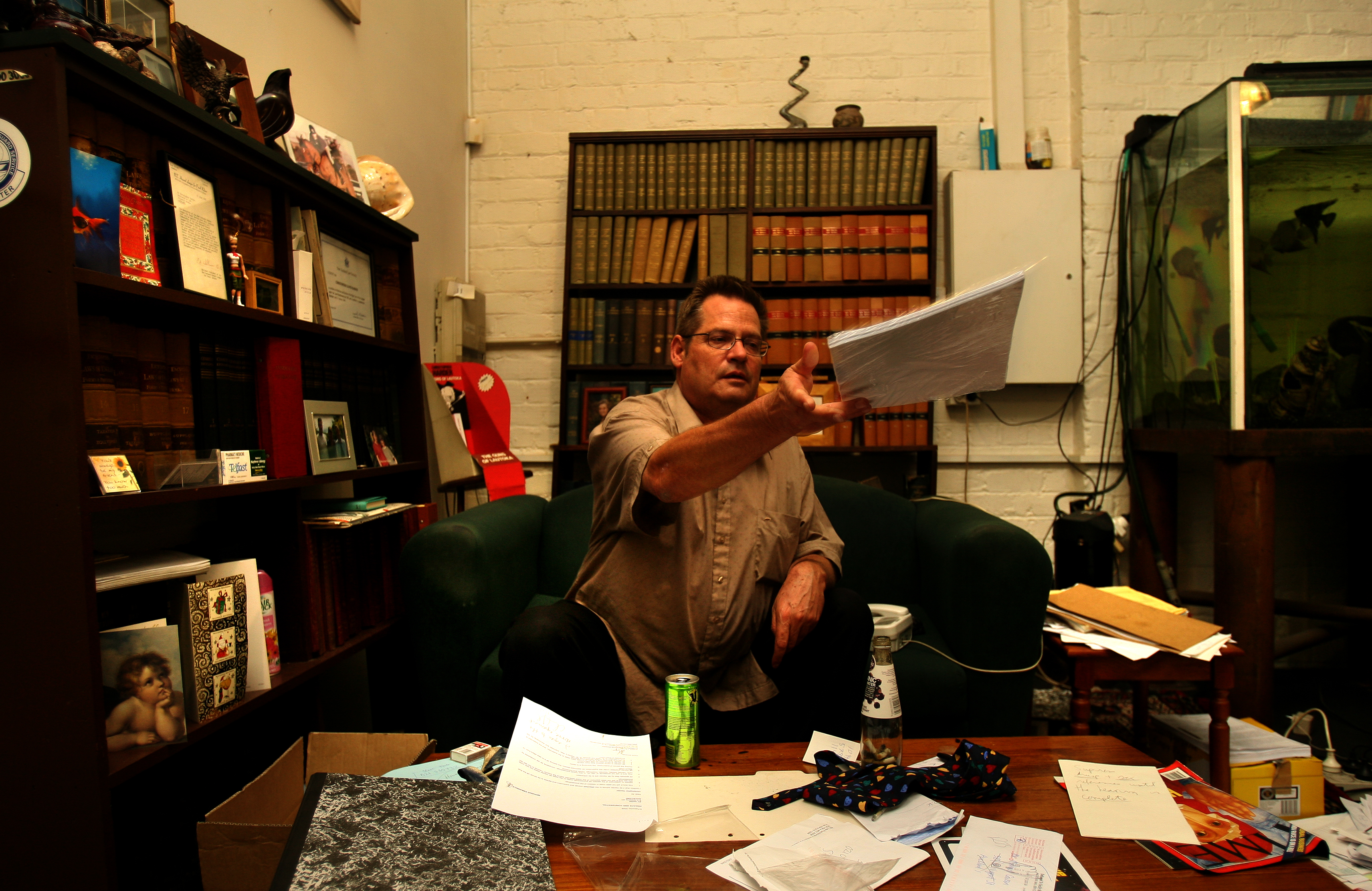 Christopher Harder sorting through paperwork in 2006 at his Central Auckland office after being struck off.