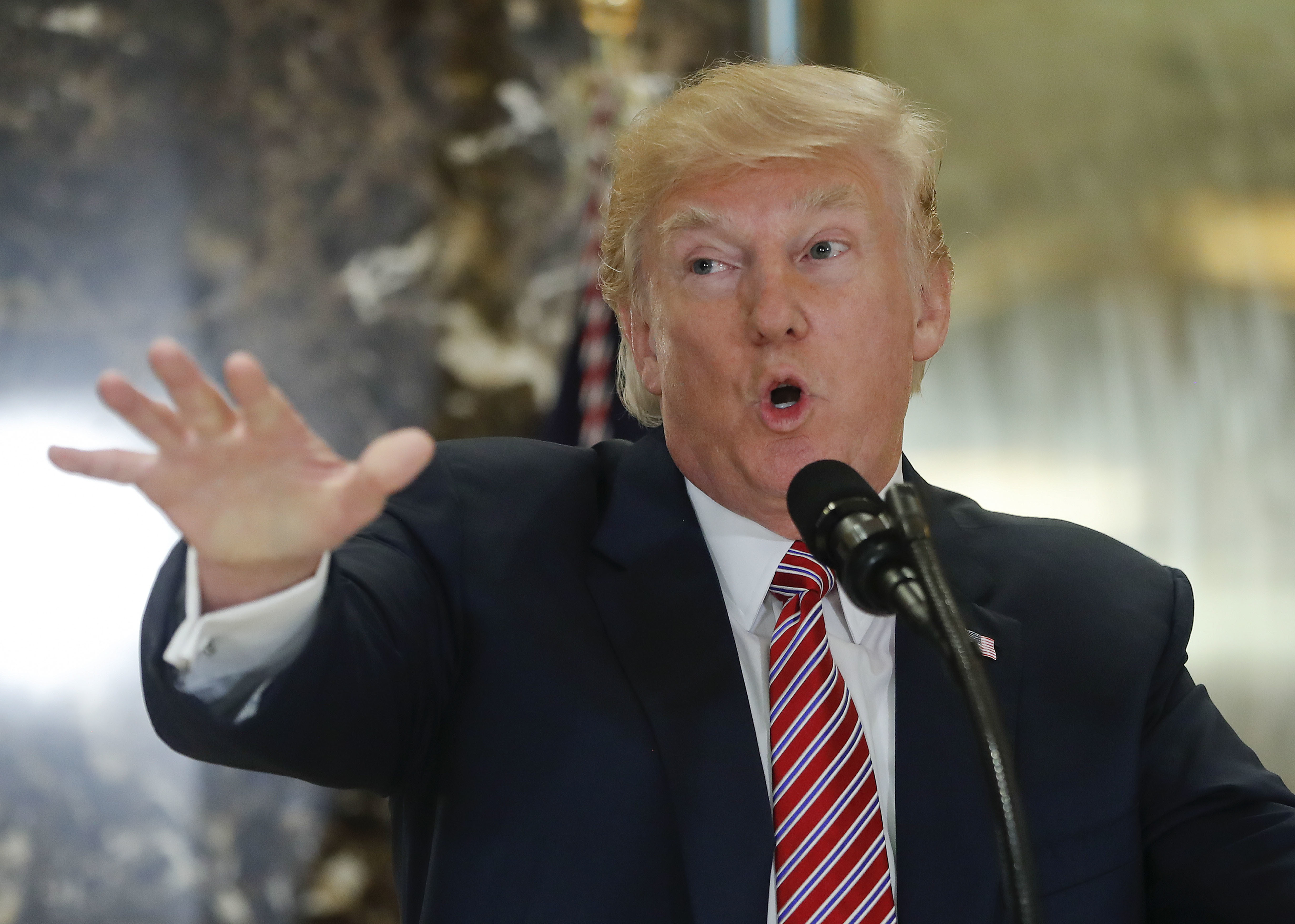 US President Donald Trump gestures as he speaks to the media in the lobby of Trump Tower in New York. Photo / AP