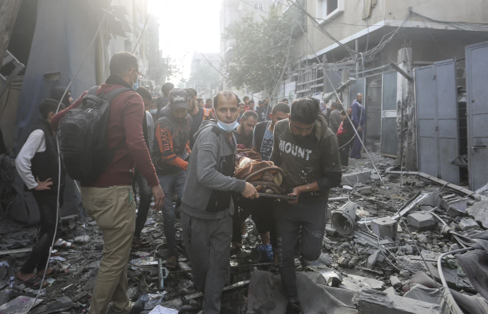Palestinians evacuate a wounded person after in Israeli bombardment in Rafah, Gaza Strip. Photo / AP