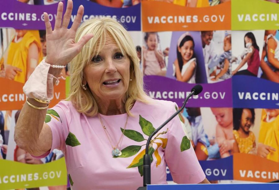 First lady Jill Biden waves as she speaks during a tour of a health facility. Photo / AP