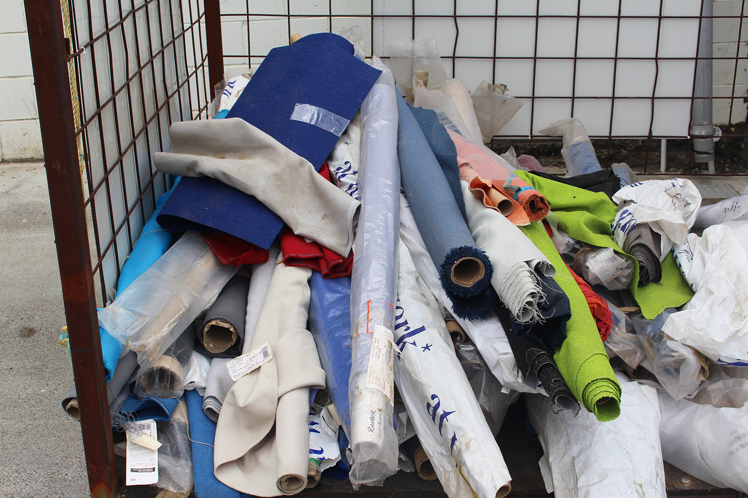 These rolls of fabric sit just outside of Textile Products in Onehunga, awaiting their turn to run through a recycling machine. Photo / Madeleine Crutchley