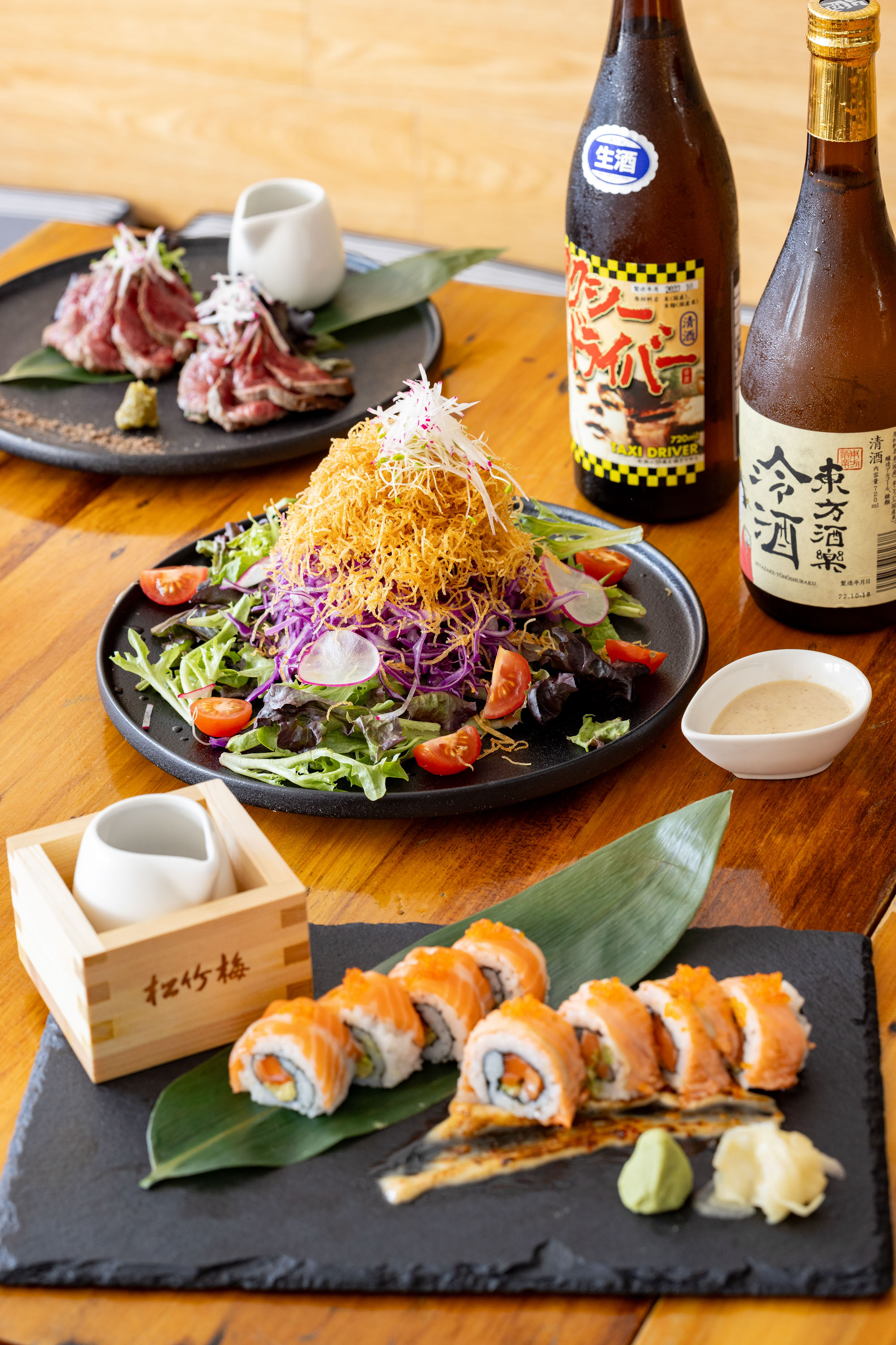 Japanese restaurant Okome’s beef tataki, salad and salmon sushi. Photo / Babiche Martens