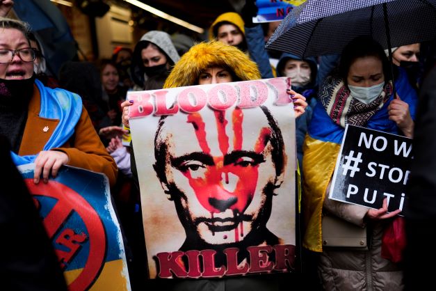 Pro-Ukraine people shout slogans during a small protest outside the Russian consulate in Istanbul, Turkey, on February 24, 2022, after Russian troops launched an attack on Ukraine. Photo / via AP 